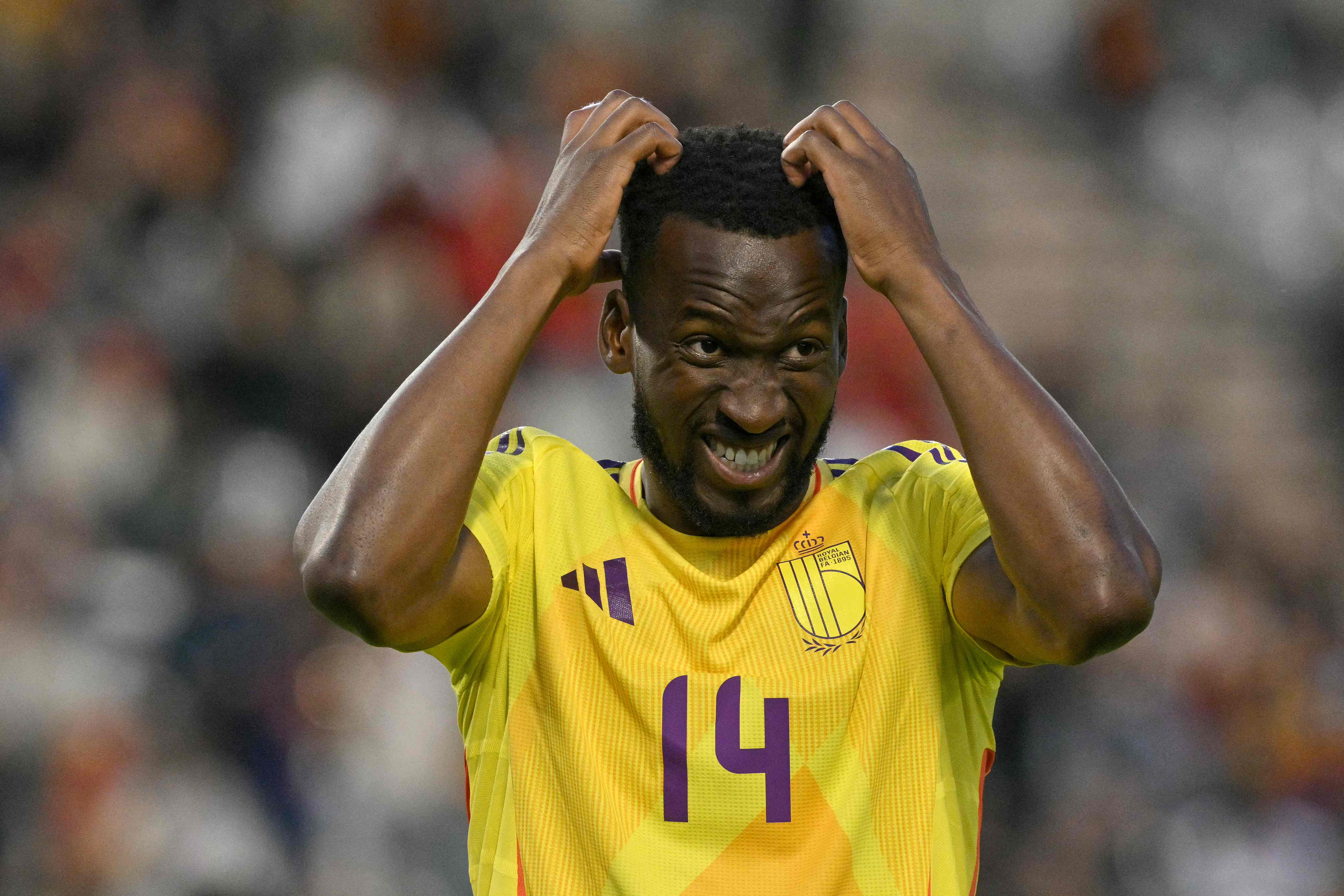 Belgium's midfielder #14 Dodi Lukebakio reacts after missing a goal scoring opportunity during the FIFA World Cup 2026 Group J European qualification football match between Belgium and Wales at the King Baudouin Stadium in Brussels, on June 9, 2025. (Photo by NICOLAS TUCAT / AFP)