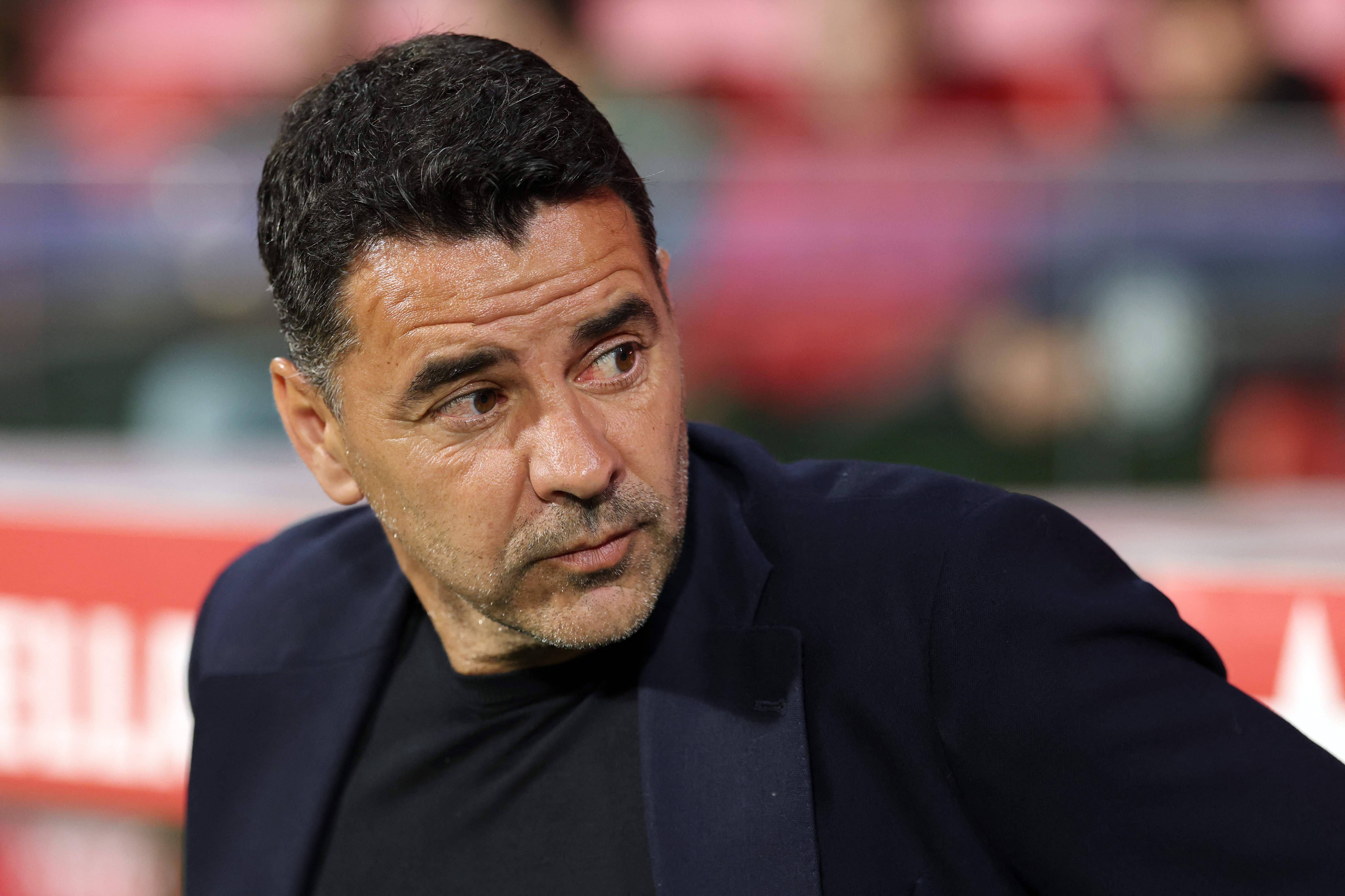 Girona's Spanish coach Michel is seen before the Spanish league football match between Girona FC and Villarreal CF at Montilivi Stadium in Girona on April 6, 2026. (Photo by Lluis GENE / AFP)