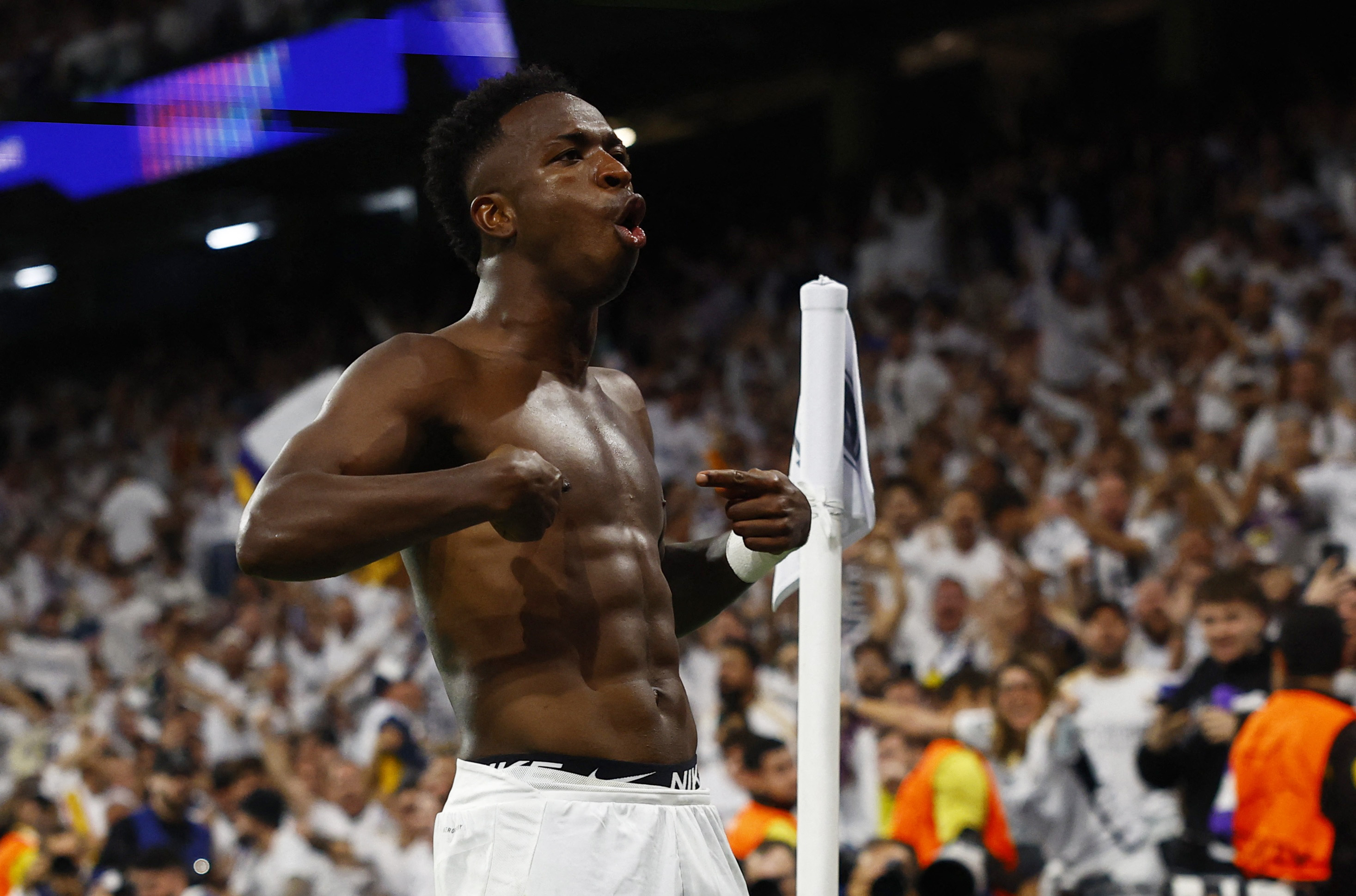 Soccer Football - Champions League - Real Madrid v Borussia Dortmund - Santiago Bernabeu, Madrid, Spain - October 22, 2024 Real Madrid's Vinicius Junior celebrates scoring their fourth goal REUTERS/Susana Vera