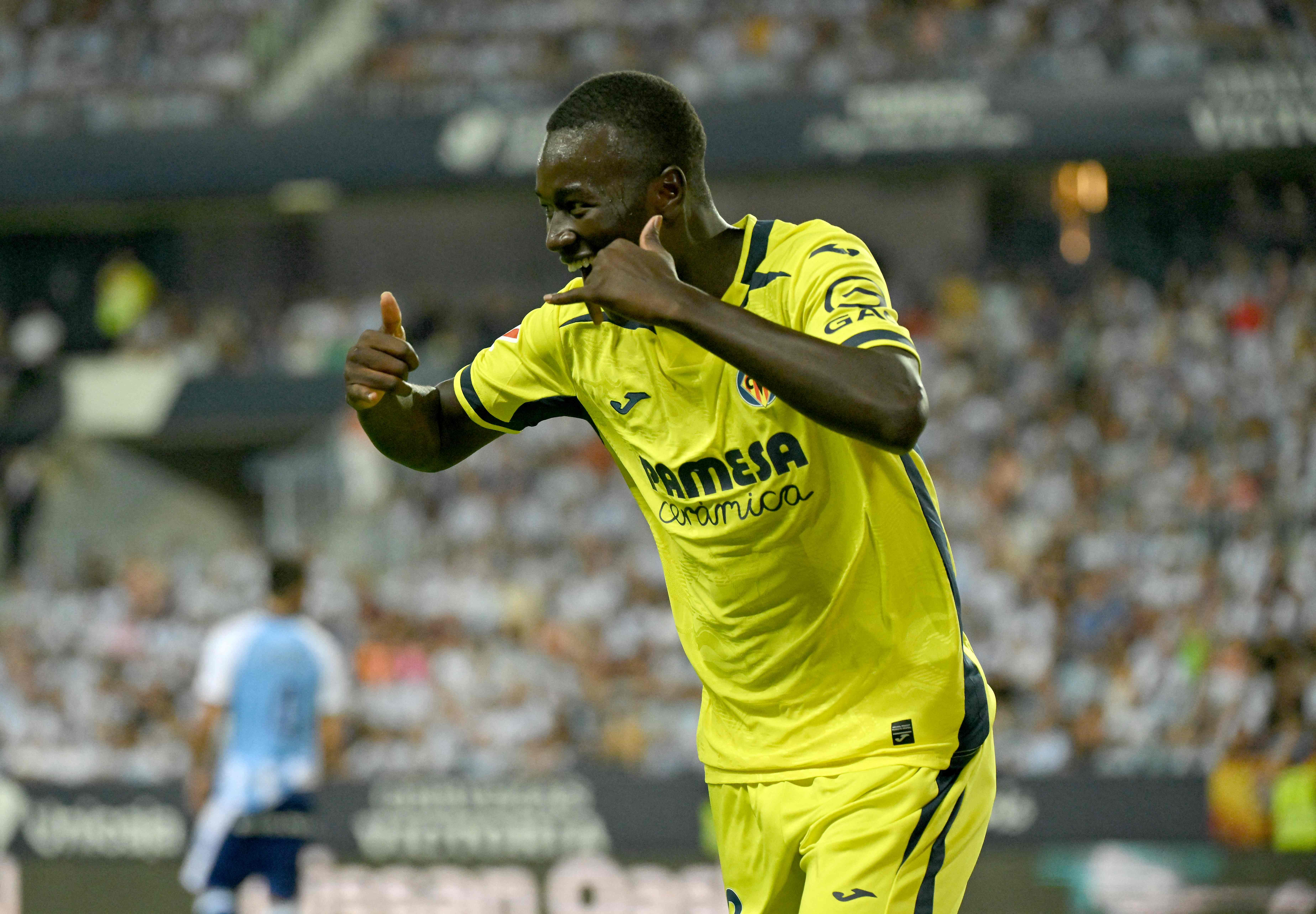 Villarreal's Senegalese midfielder #18 Pape Gueye celebrates scoring his team's second goal during the Spanish league football match between Malaga CF and Villarreal CF at La Rosaleda Stadium in Malaga on September 17, 2026. (Photo by JORGE GUERRERO / AFP)