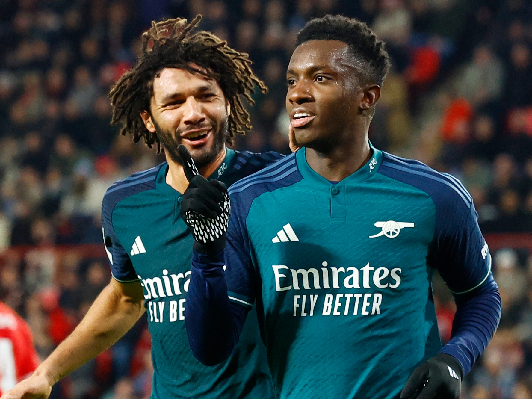 Soccer Football - Champions League - Group B - PSV Eindhoven v Arsenal - Philips Stadion, Eindhoven, Netherlands - December 12, 2023 Arsenal's Eddie Nketiah celebrates scoring their first goal with Mohamed Elneny REUTERS/Piroschka Van De Wouw