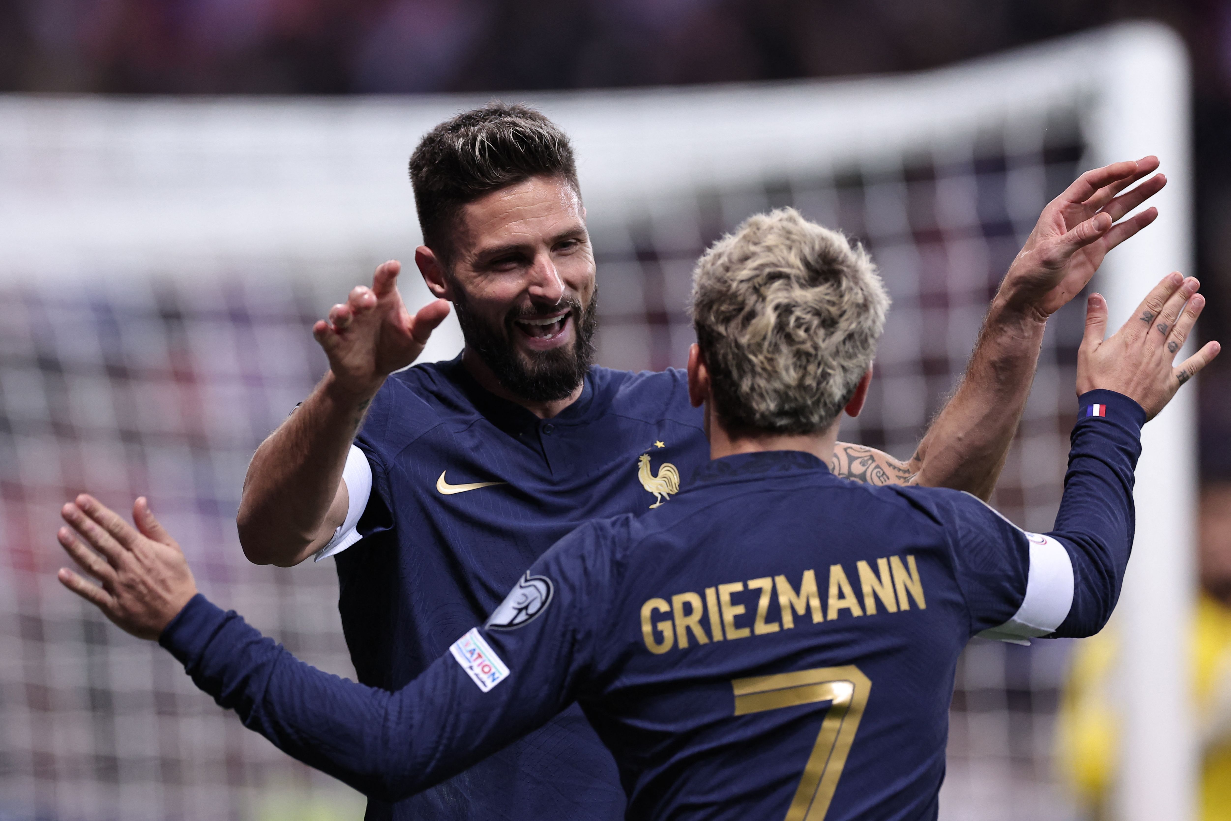 France's forward #09 Olivier Giroud celebrates with France's forward #07 Antoine Griezmann after scoring a goal during the UEFA EURO 2024 Group B qualifying football match between France and Gibraltar at the Allianz Riviera stadium in Nice, southeastern France, on November 18, 2023. (Photo by FRANCK FIFE / AFP)
