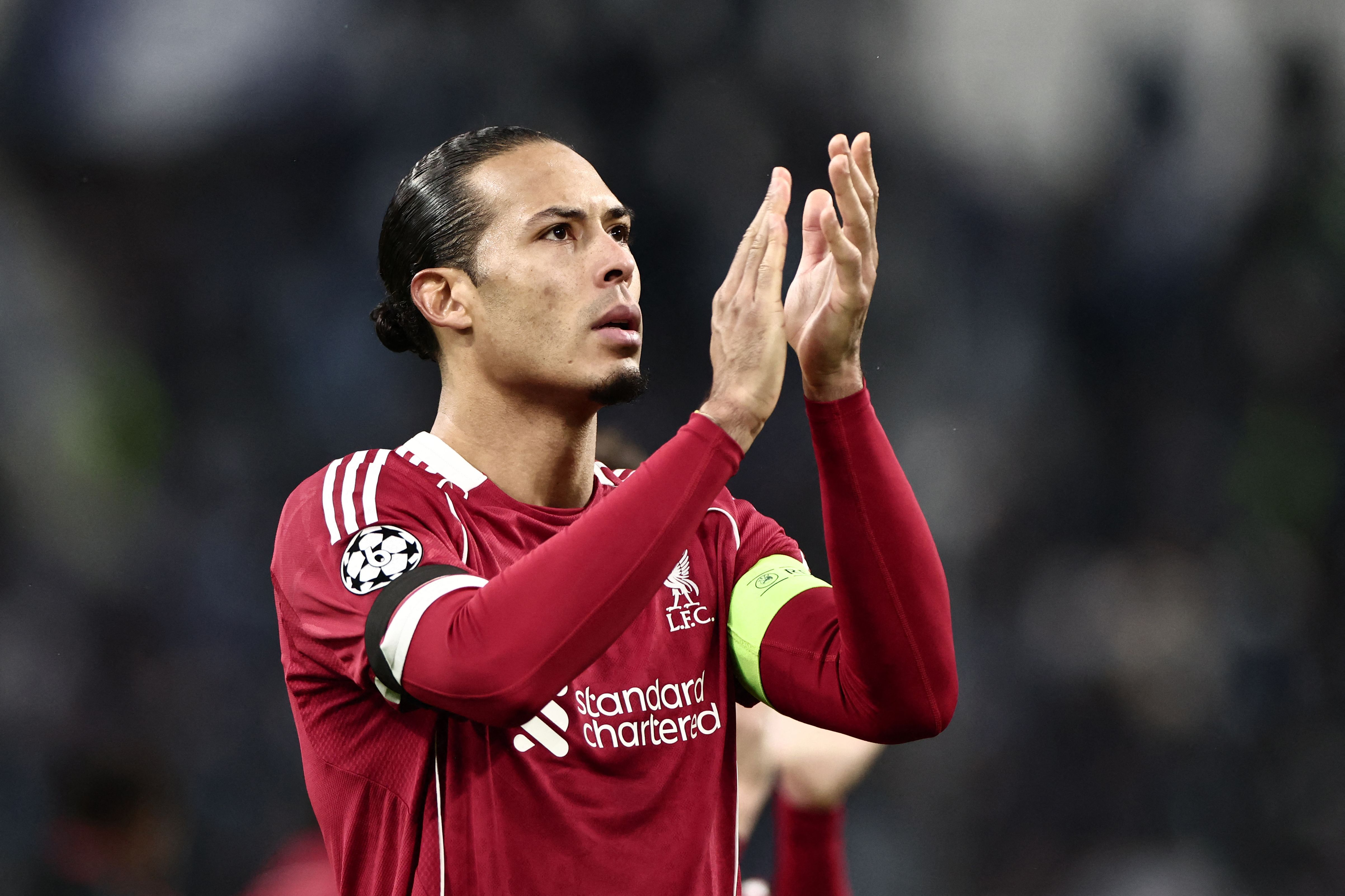Liverpool's Dutch defender #04 Virgil van Dijk claps to supporters at the end of the UEFA Champions League, league phase day 7, football match between Olympique de Marseille (OM) and Liverpool FC at the Stade Velodrome in Marseille, southern France, on January 21, 2026. (Photo by Thibaud MORITZ / AFP)