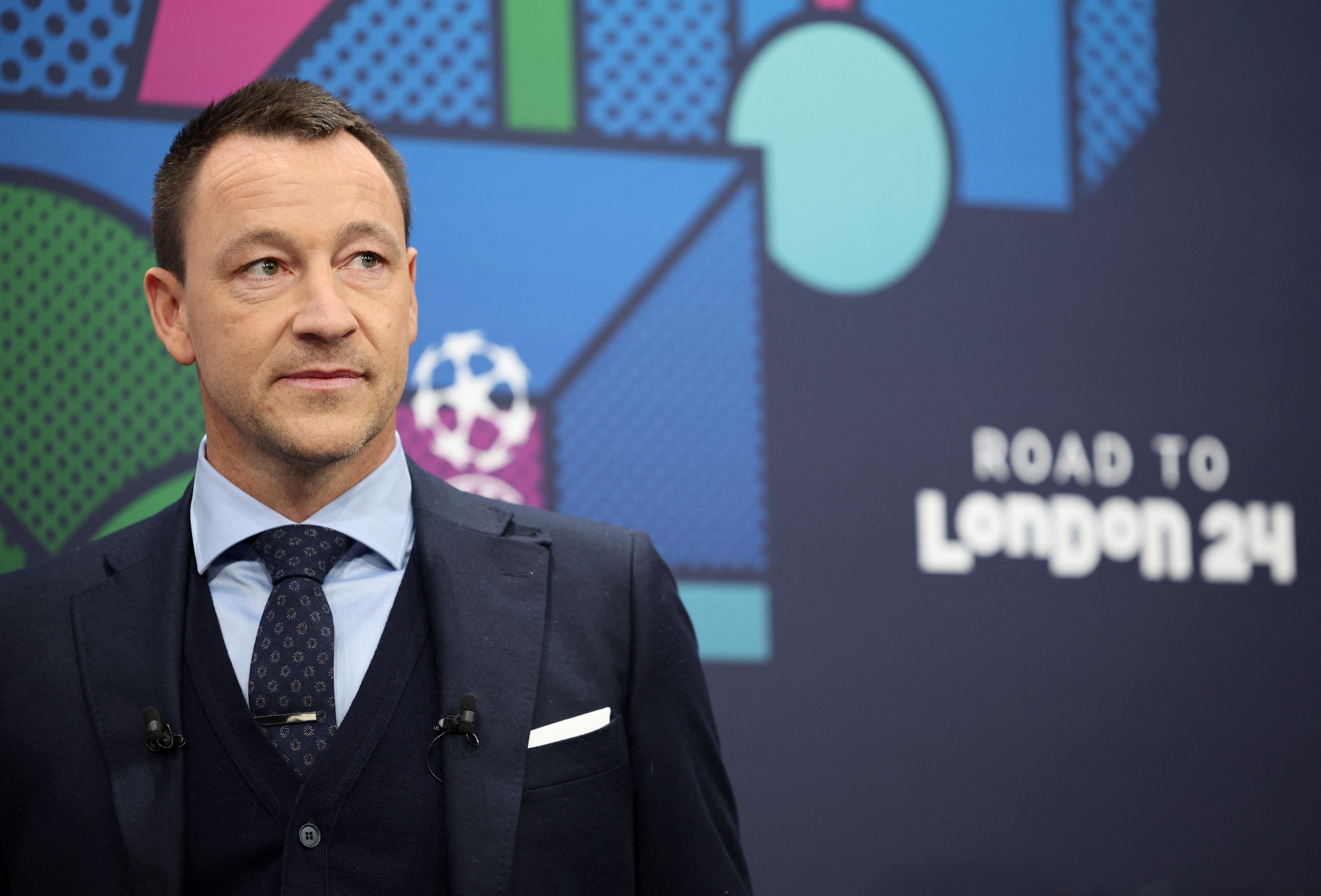 Soccer Football - Champions League - Round of 16 Draw - Nyon, Switzerland - December 18, 2023 Former Chelsea player John Terry during the draw REUTERS/Pierre Albouy