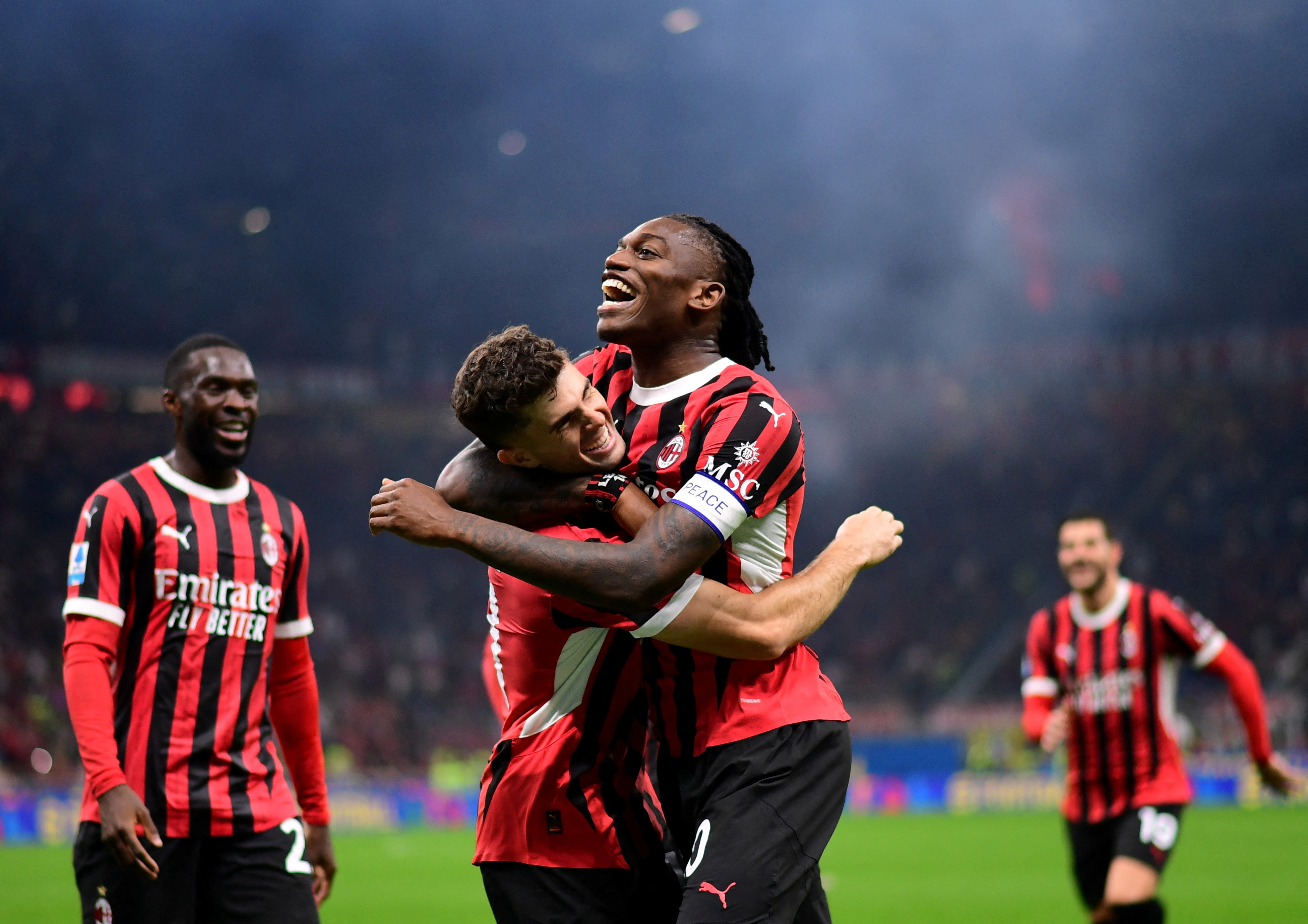 Soccer Football - Serie A - AC Milan v Lecce - San Siro, Milan, Italy - September 27, 2024 AC Milan's Christian Pulisic celebrates scoring their third goal with Rafael Leao REUTERS/Daniele Mascolo     TPX IMAGES OF THE DAY