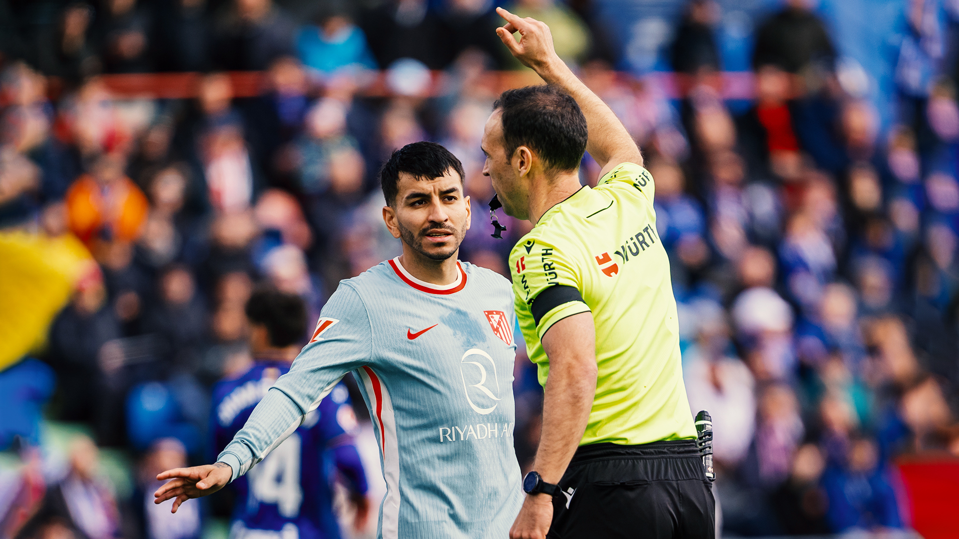 Angel Correa of Atletico de Madrid (L) protests with referee Guillermo Cuadra Fernandez (R) during the La Liga EA Sports 2024/25 football match between Getafe CF and Atletico de Madrid at Estadio Coliseum in Getafe, Spain, on March 9, 2024. (Photo by Alberto Gardin/NurPhoto via Getty Images)