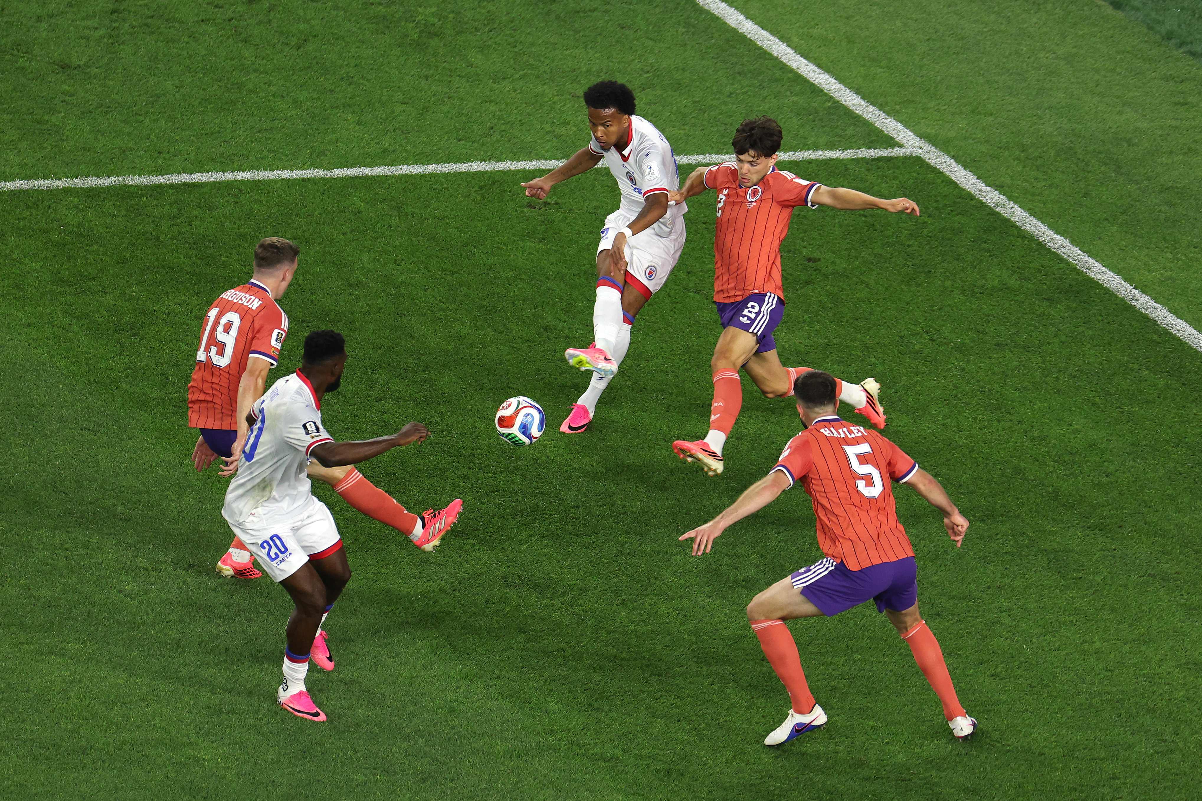 FOXBOROUGH, MASSACHUSETTS - JUNE 13: Ruben Providence #15 of Haiti passes the ball during the FIFA World Cup 2026 Group C match between Haiti and Scotland at Boston Stadium on June 13, 2026 in Foxborough, Massachusetts.   Mattia Ozbot/Getty Images/AFP (Photo by Mattia Ozbot / GETTY IMAGES NORTH AMERICA / Getty Images via AFP)