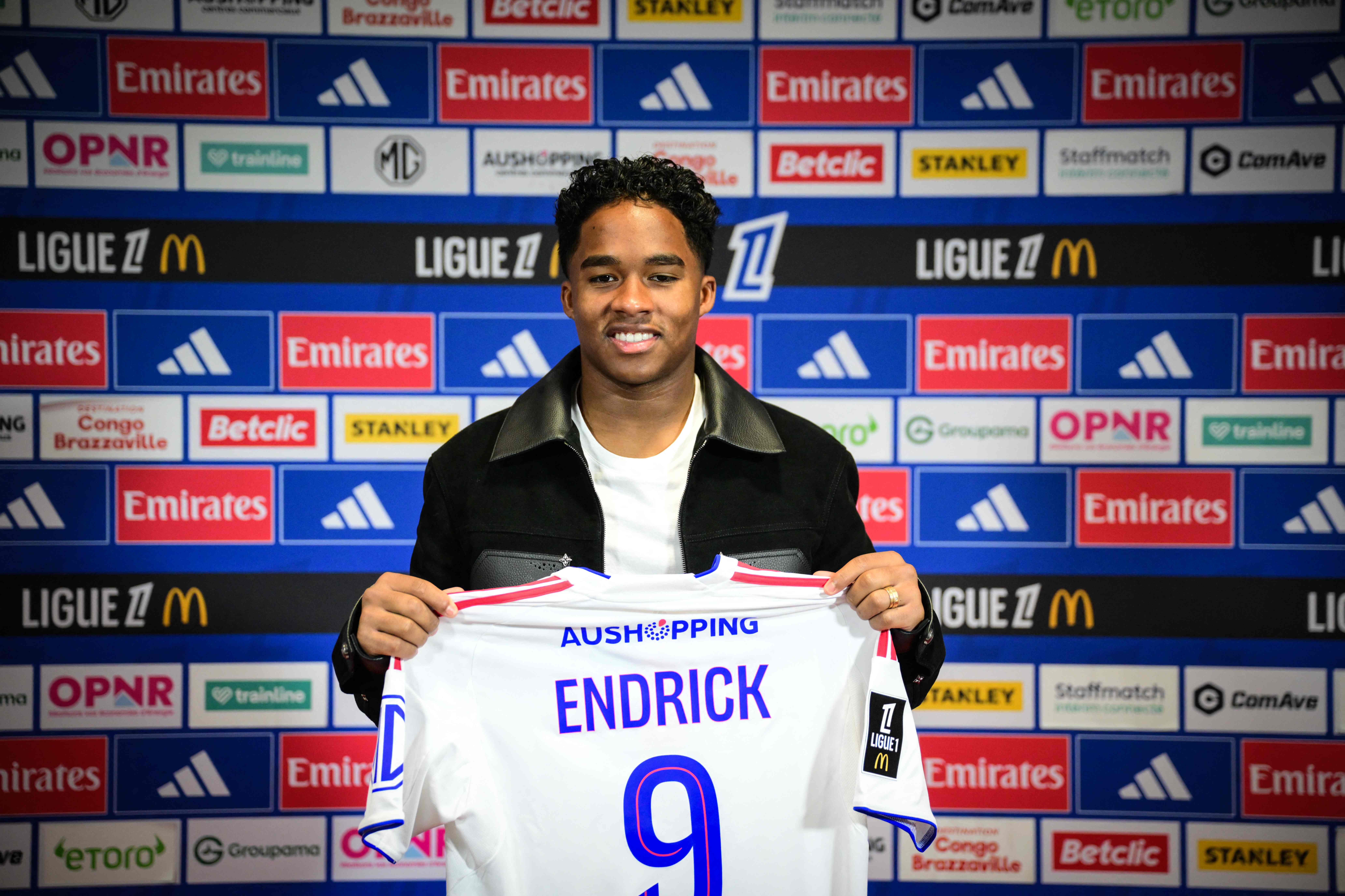 Olympique Lyonnais� Brazilian forward #09 Endrick poses with his jersey as he takes part in his official presentation press conference at the OL training centre in Decines-Charpieu, in the suburbs of Lyon, central-eastern France, on January 5, 2026. (Photo by OLIVIER CHASSIGNOLE / AFP)