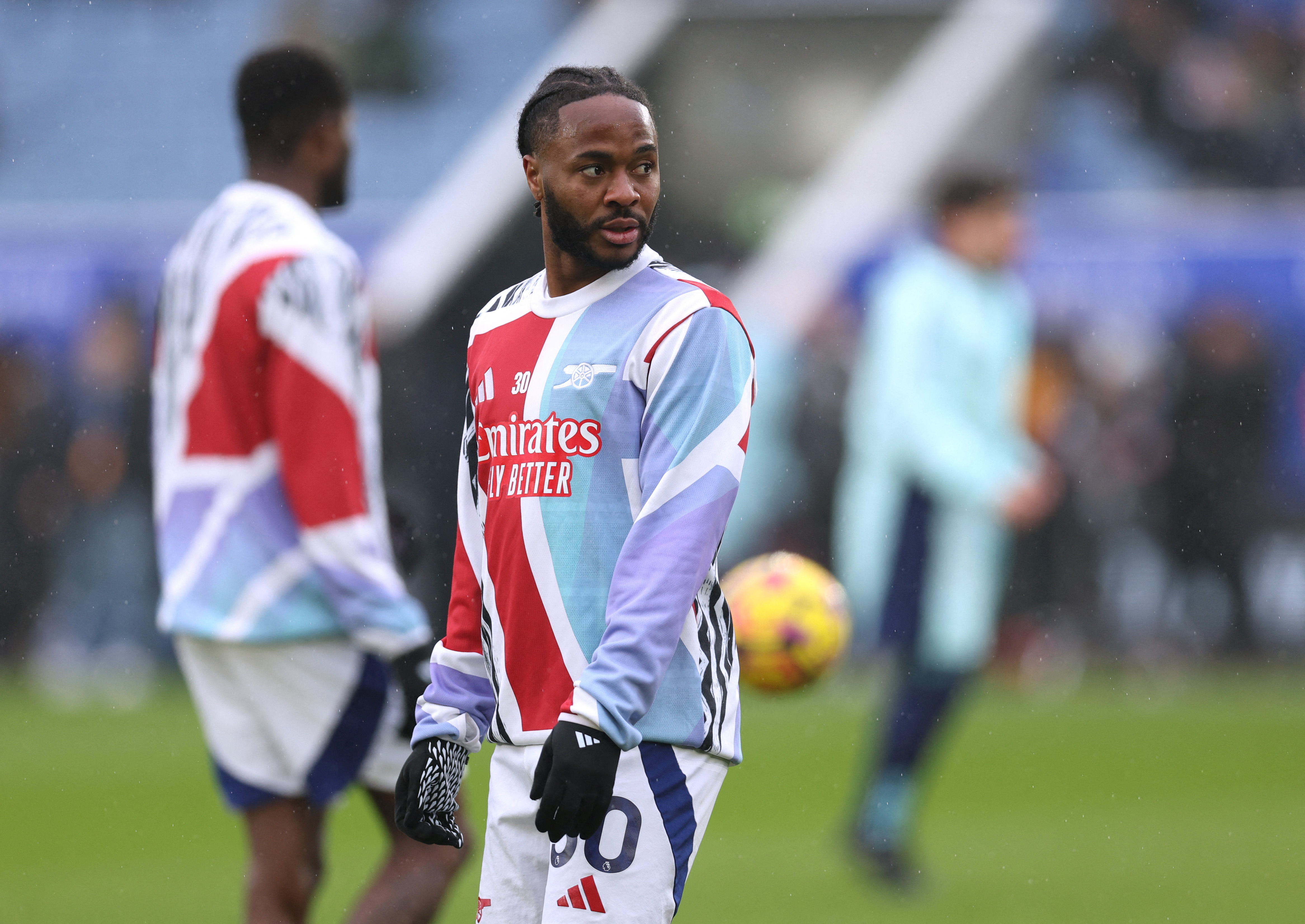 Soccer Football - Premier League - Leicester City v Arsenal - King Power Stadium, Leicester, Britain - February 15, 2025 Arsenal's Raheem Sterling during the warm up before the match REUTERS/Chris Radburn EDITORIAL USE ONLY. NO USE WITH UNAUTHORIZED AUDIO, VIDEO, DATA, FIXTURE LISTS, CLUB/LEAGUE LOGOS OR 'LIVE' SERVICES. ONLINE IN-MATCH USE LIMITED TO 120 IMAGES, NO VIDEO EMULATION. NO USE IN BETTING, GAMES OR SINGLE CLUB/LEAGUE/PLAYER PUBLICATIONS. PLEASE CONTACT YOUR ACCOUNT REPRESENTATIVE FOR FURTHER DETAILS..