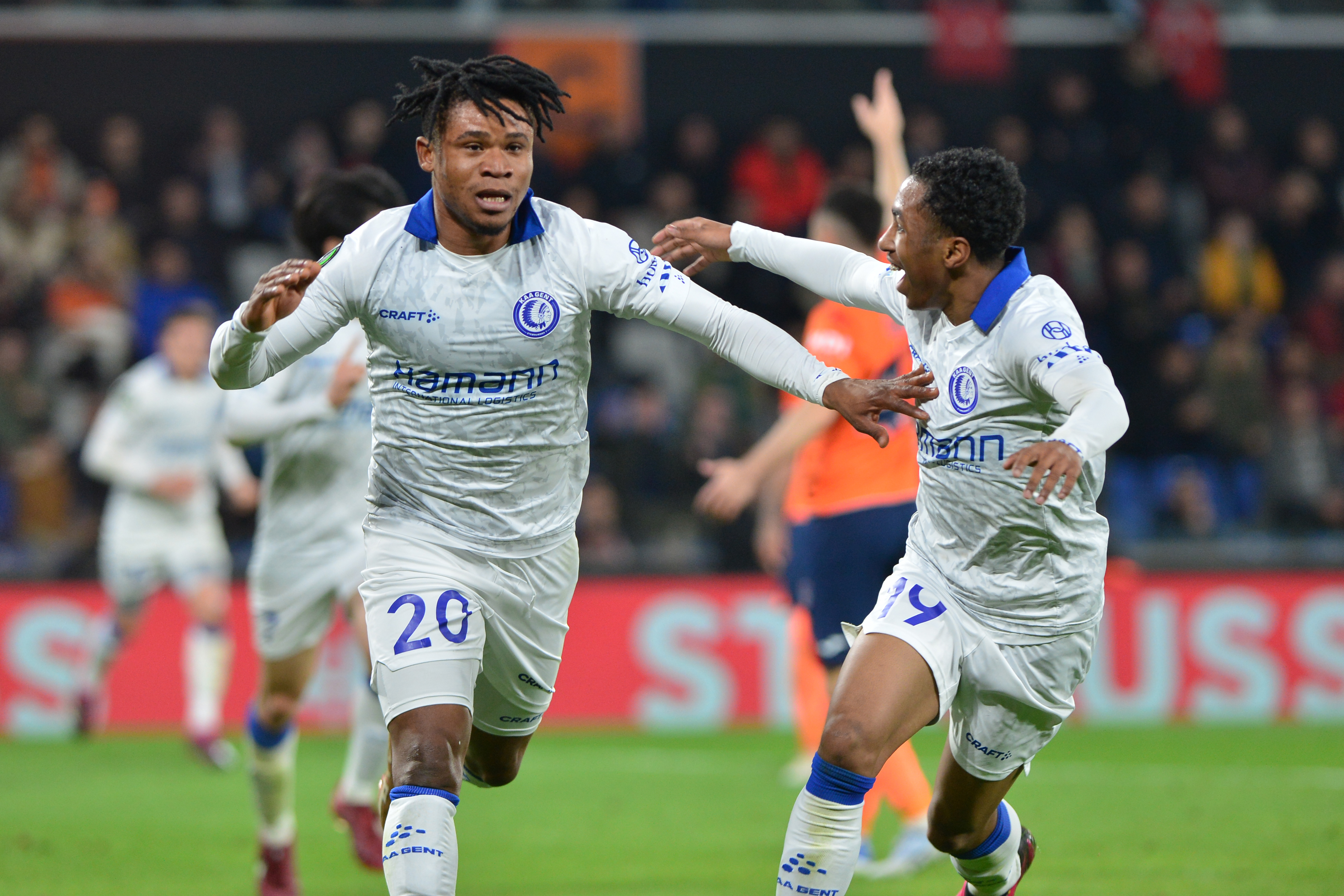 ISTANBUL, TURKEY - MARCH 15:  Gift Emmanuel Orban #20 of KAA Gent celebrates after scoring the first goal of his team with Malick Martin Fofana (R) during the UEFA Europa Conference League round of 16 leg two match between Istanbul Basaksehir and KAA Gent at Basaksehir Fatih Terim Stadyumu on March 15, 2023 in Istanbul, Turkey. (Photo by Seskim Photo/MB Media/Getty Images)