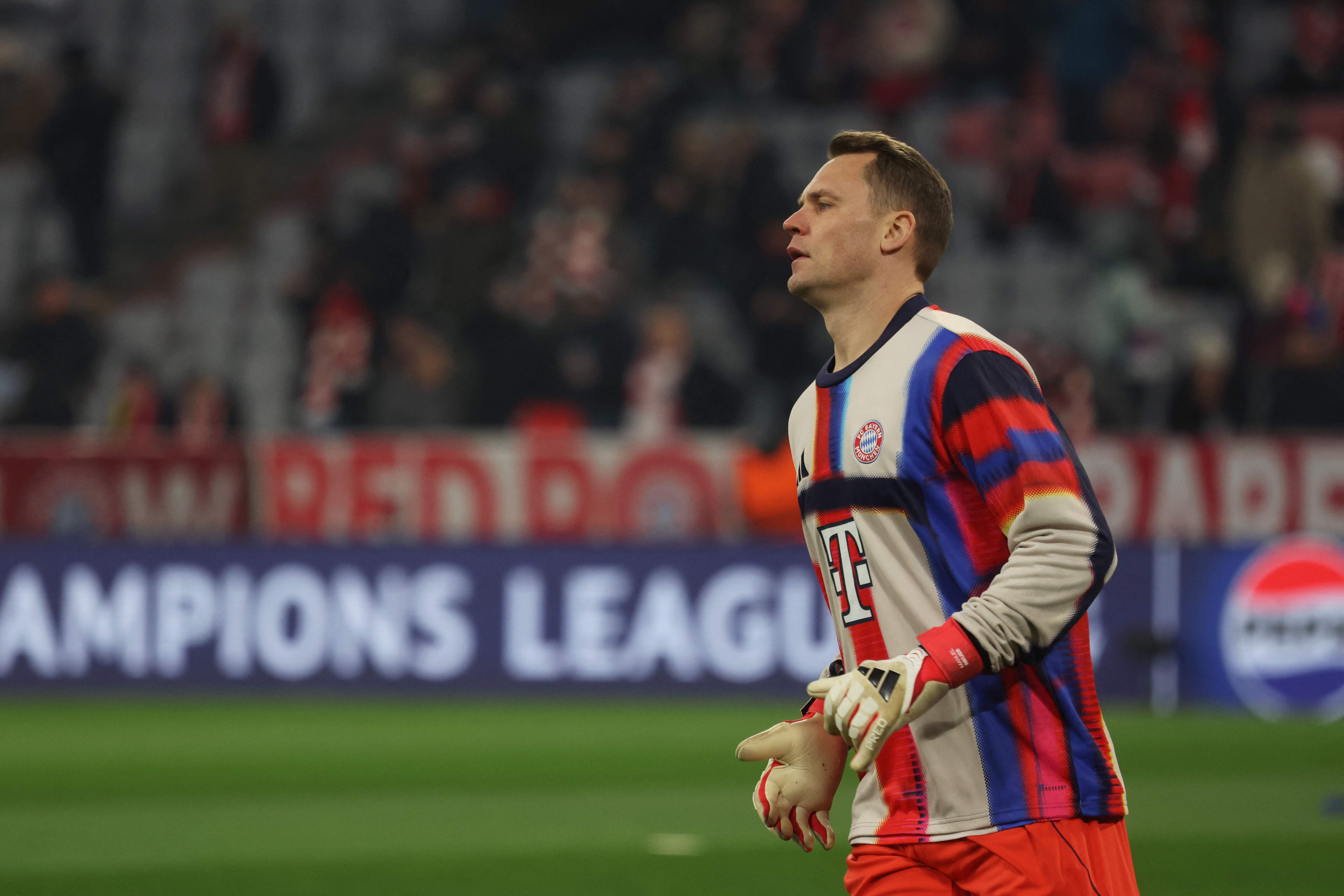 Bayern Munich's German goalkeeper #01 Manuel Neuer warms up prior to the start the UEFA Champions League football match between FC Bayern Munich (GER) and Union St-Gilloise (BEL) in Munich, southern Germany, on January 21, 2026. (Photo by Karl-Josef HILDENBRAND / AFP)
