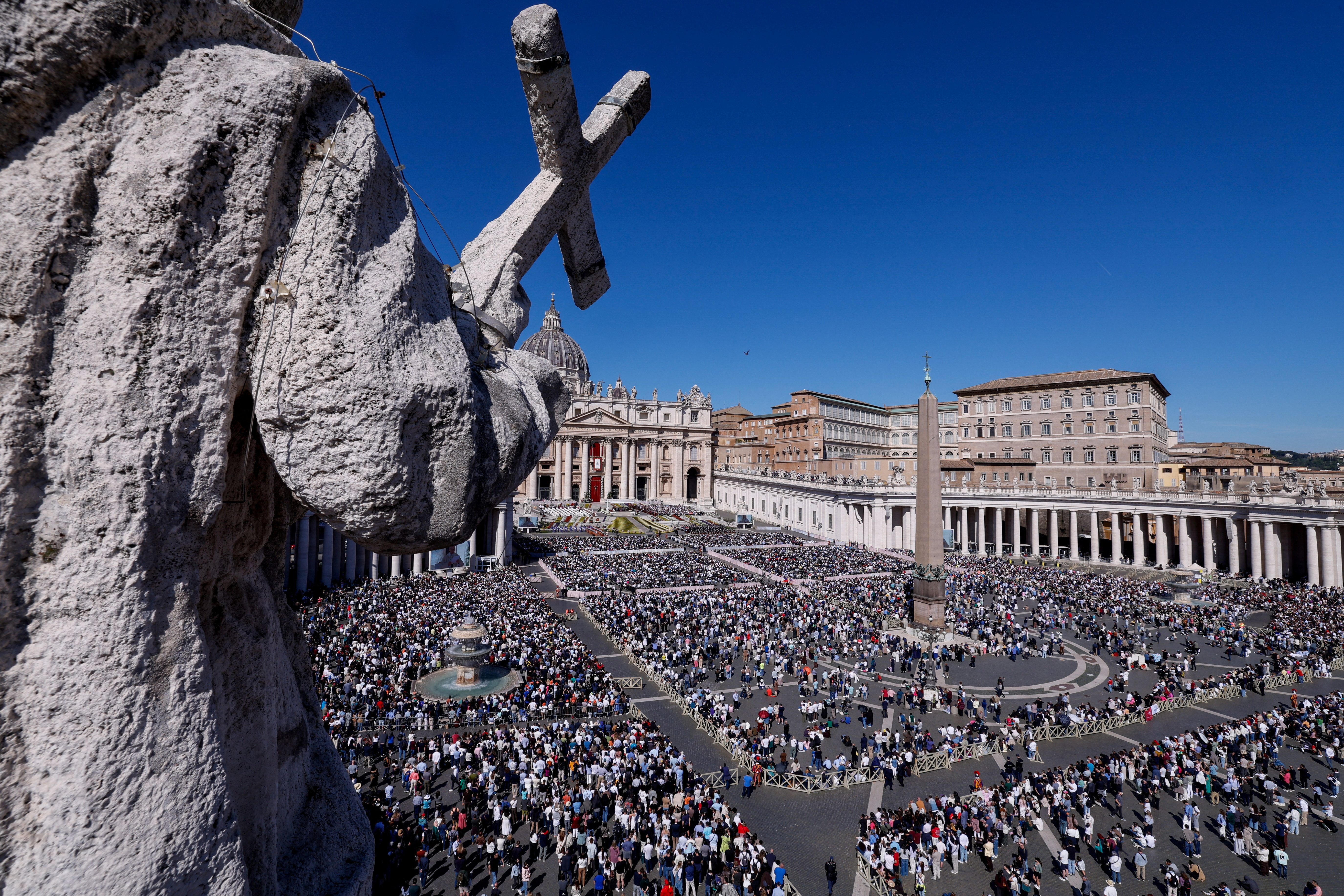 People attend the Easter Mass led by Pope Leo XIV in St. Peter's Square at the Vatican, April 5, 2026. REUTERS/Remo Casilli