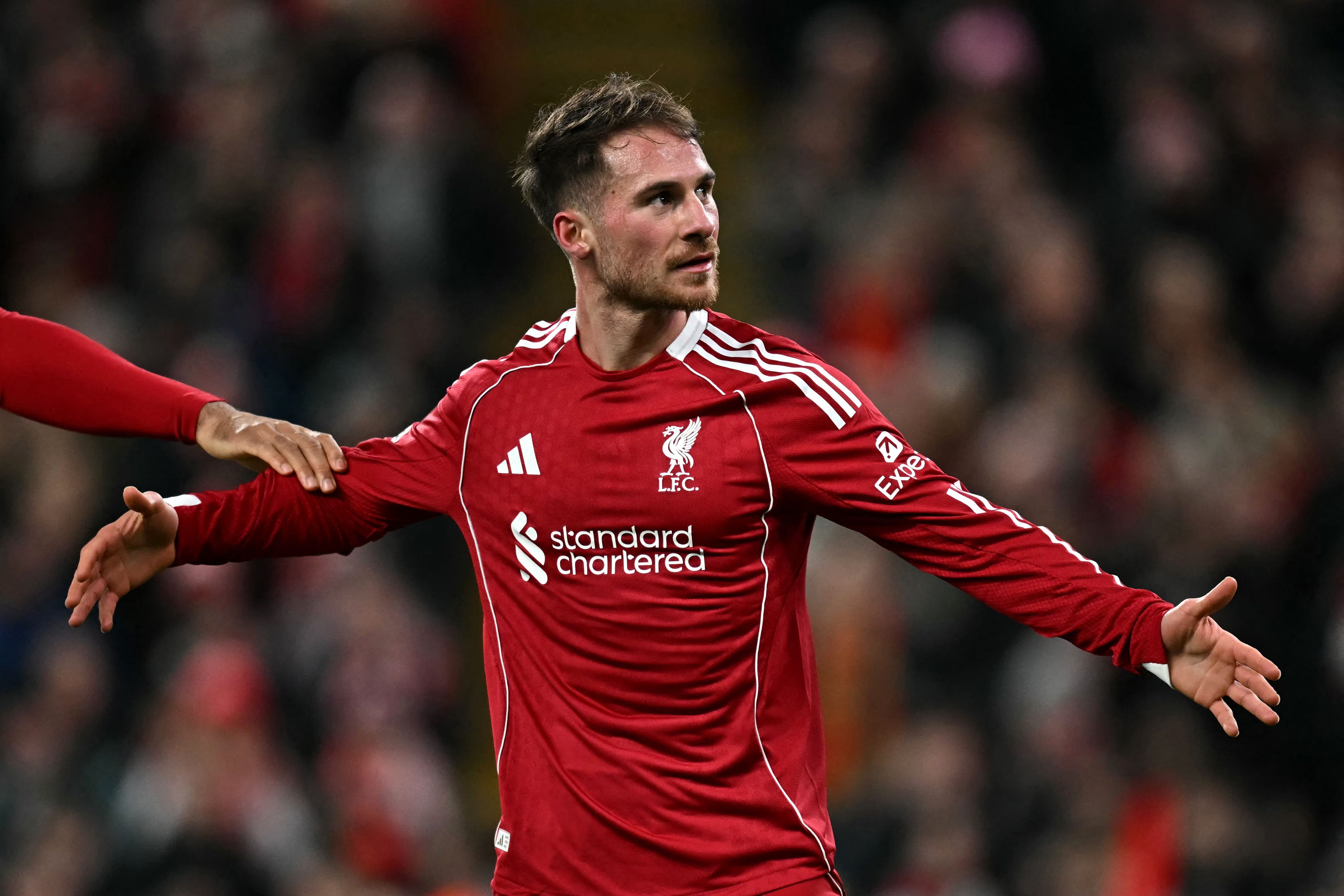 Liverpool's Argentinian midfielder #10 Alexis Mac Allister celebrates scoring the team's first goal during the UEFA Champions League football match between Liverpool and Qarabag at Anfield in Liverpool, north west England on January 28, 2026. (Photo by Paul ELLIS / AFP)