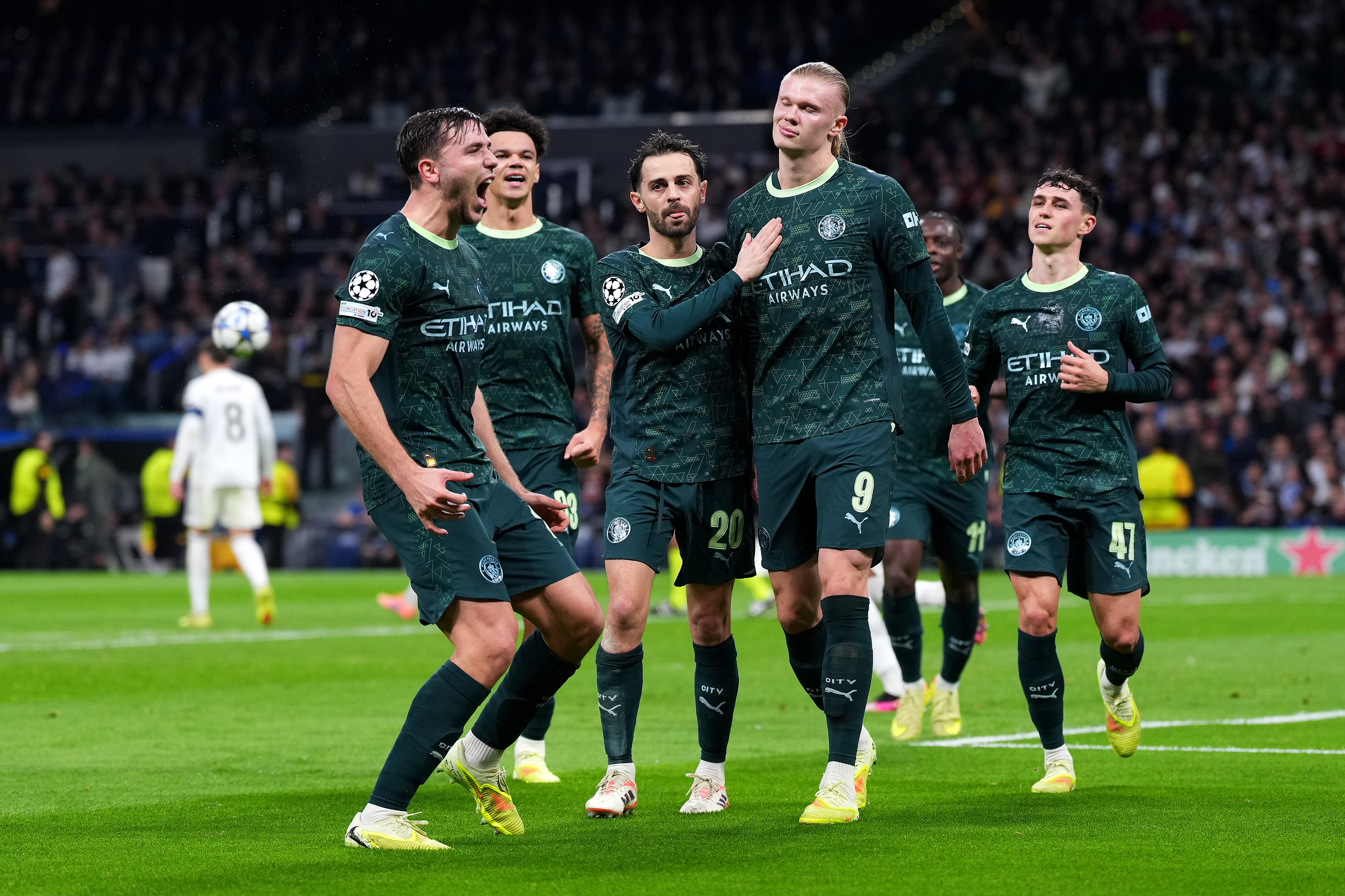 MADRID, SPAIN - DECEMBER 10: Erling Haaland of Manchester City celebrates with teammates after scoring his team's second goal from the penalty spot during the UEFA Champions League 2025/26 League Phase MD6 match between Real Madrid C.F. and Manchester City at Estadio Santiago Bernabeu on December 10, 2025 in Madrid, Spain. (Photo by Aitor Alcalde/Getty Images)