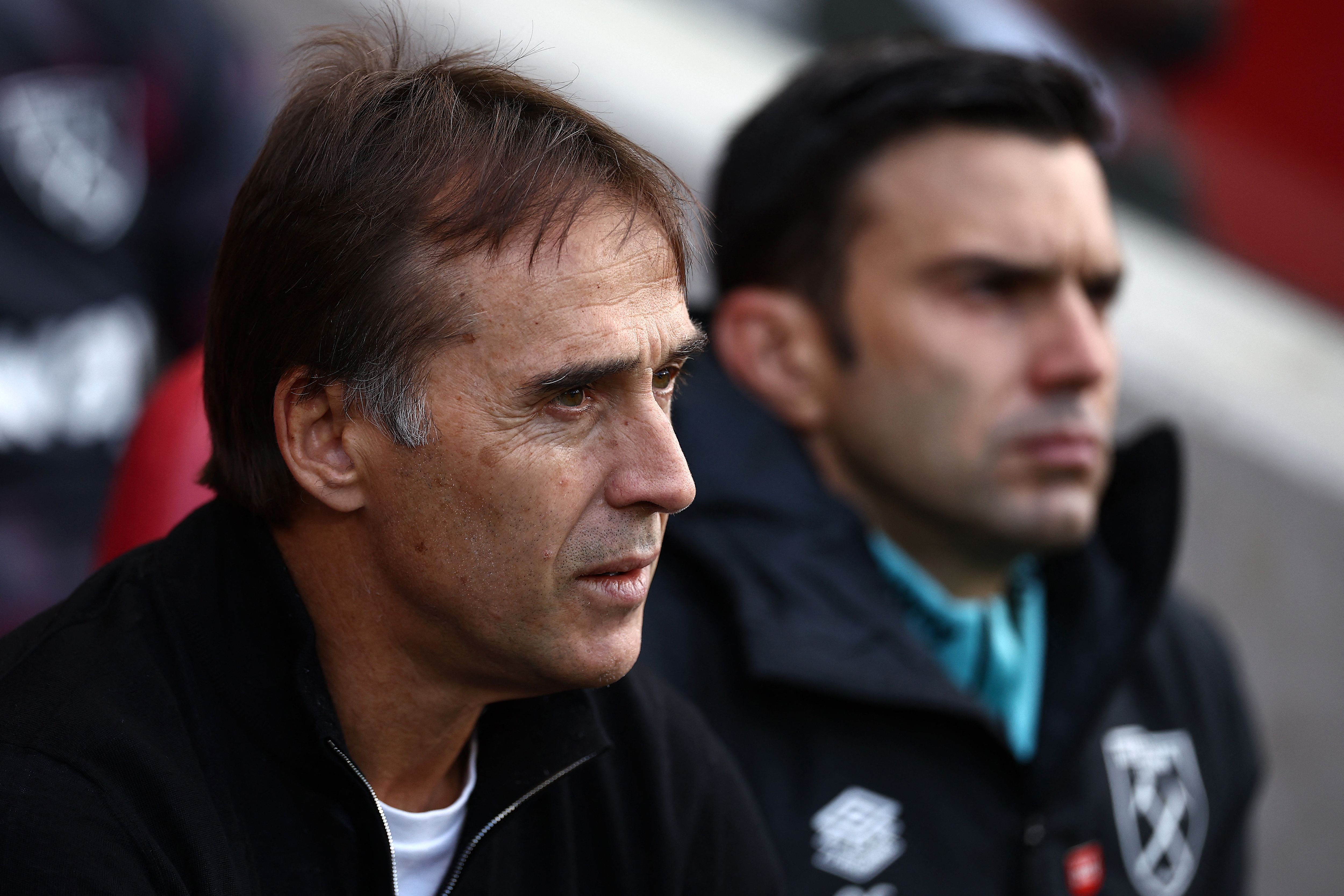 West Ham United's Spanish manager Julen Lopetegui (L) reacts ahead of the English Premier League football match between Brentford and West Ham United at the Gtech Community Stadium in London on September 28, 2024. (Photo by HENRY NICHOLLS / AFP) / RESTRICTED TO EDITORIAL USE. No use with unauthorized audio, video, data, fixture lists, club/league logos or 'live' services. Online in-match use limited to 120 images. An additional 40 images may be used in extra time. No video emulation. Social media in-match use limited to 120 images. An additional 40 images may be used in extra time. No use in betting publications, games or single club/league/player publications. / 