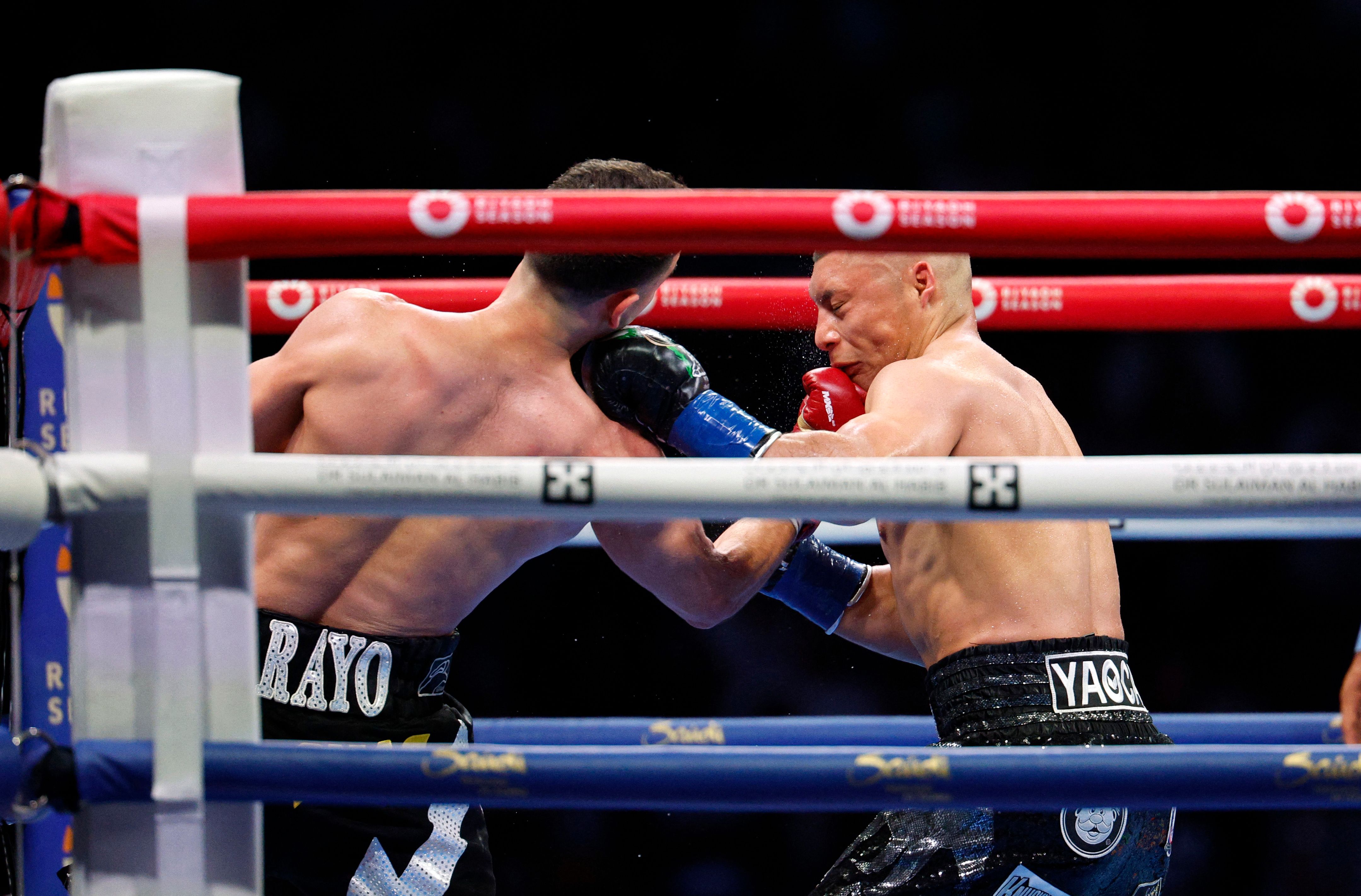 LOS ANGELES, CALIFORNIA - AUGUST 3: Jose Valenzuela lands a punch against Isaac Cruz during the sixth round of the WBA Super Lightweight Title at BMO Stadium on August 3, 2024 in Los Angeles, California.   Kevork Djansezian/Getty Images/AFP (Photo by KEVORK DJANSEZIAN / GETTY IMAGES NORTH AMERICA / Getty Images via AFP)
