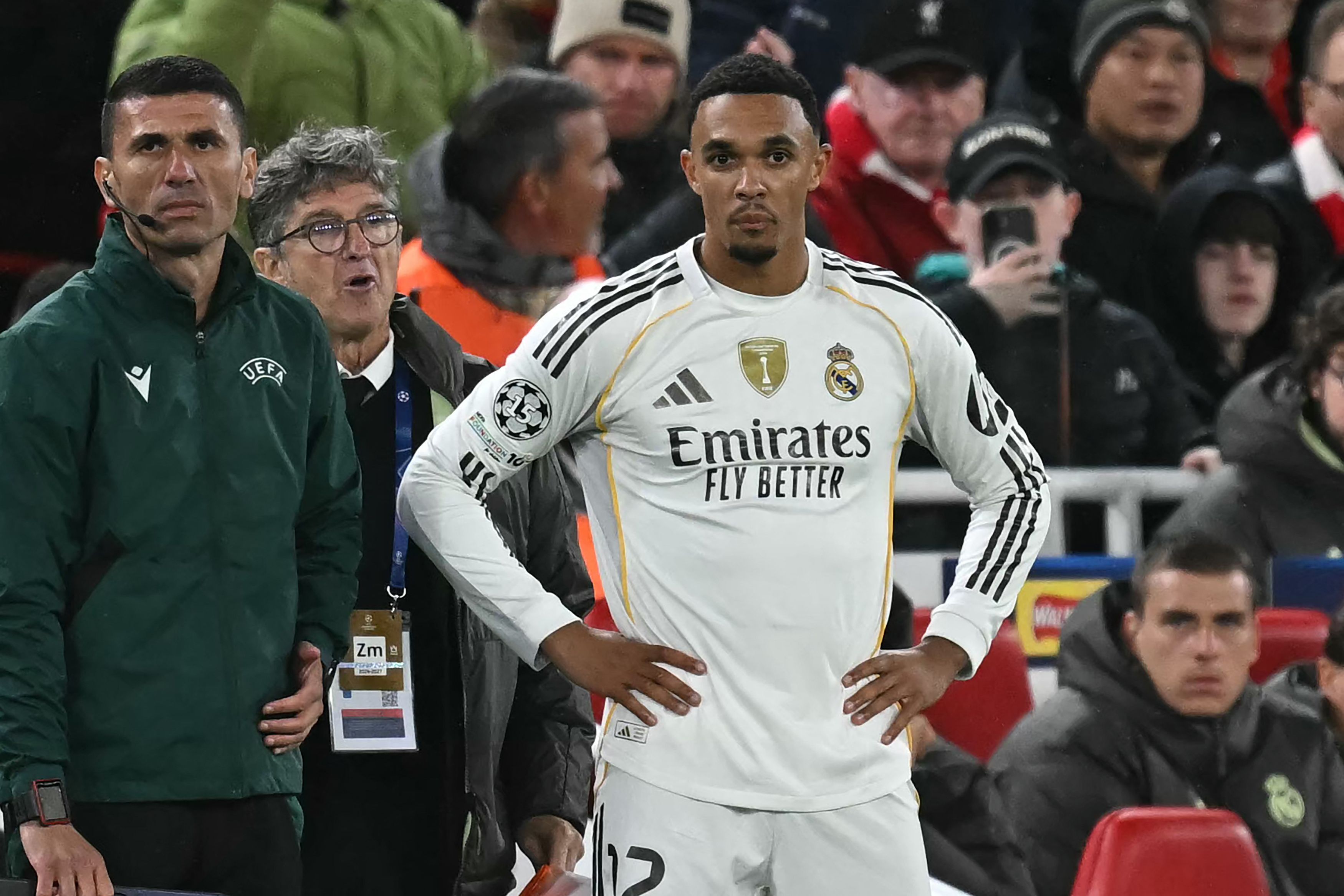 Real Madrid's English defender #12 Trent Alexander-Arnold waits to come on as a substitute during the UEFA Champions League, league phase football match between Liverpool and Real Madrid at Anfield in Liverpool, north west England on November 4, 2025. (Photo by Paul ELLIS / AFP)