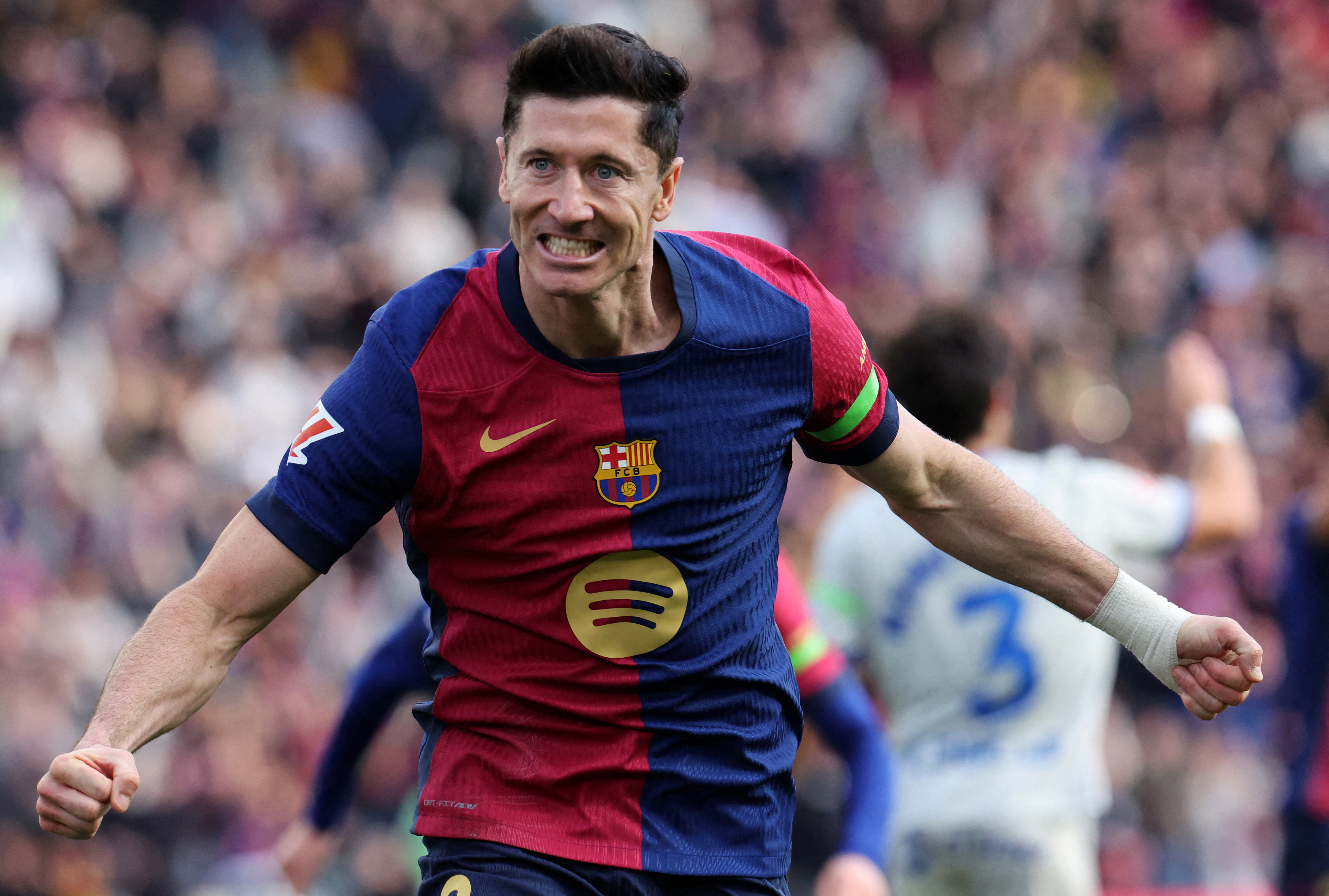 Soccer Football - LaLiga - FC Barcelona v Deportivo Alaves - Estadi Olimpic Lluis Companys, Barcelona, Spain - February 2, 2025 FC Barcelona's Robert Lewandowski celebrates scoring their first goal REUTERS/Nacho Doce     TPX IMAGES OF THE DAY