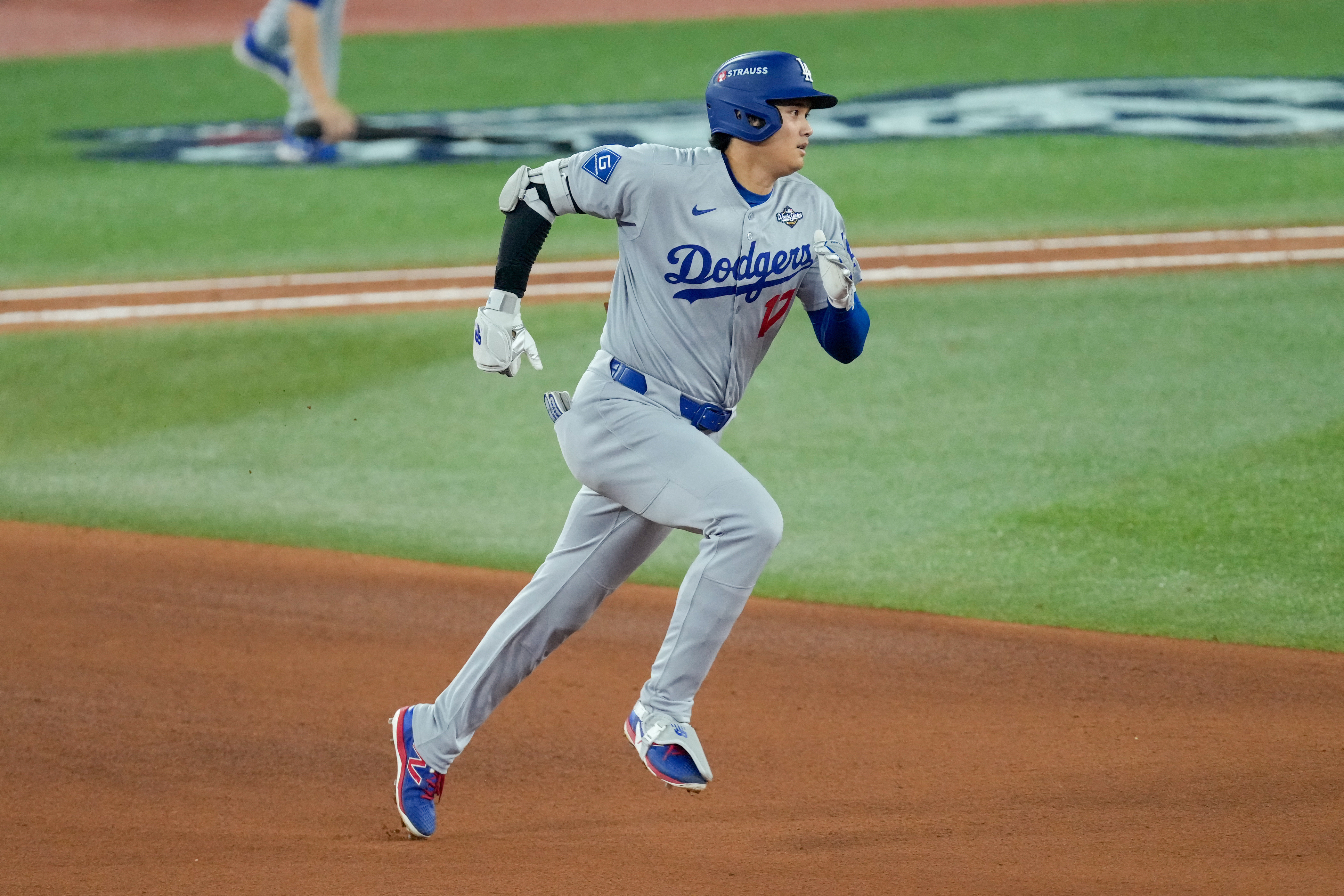 Oct 24, 2025; Toronto, Ontario, CAN; Los Angeles Dodgers designated hitter Shohei Ohtani (17) rounds the bases after hitting a two-run home run against the Toronto Blue Jays in the seventh inning during game one of the 2025 MLB World Series at Rogers Centre. Mandatory Credit: Kevin Sousa-Imagn Images