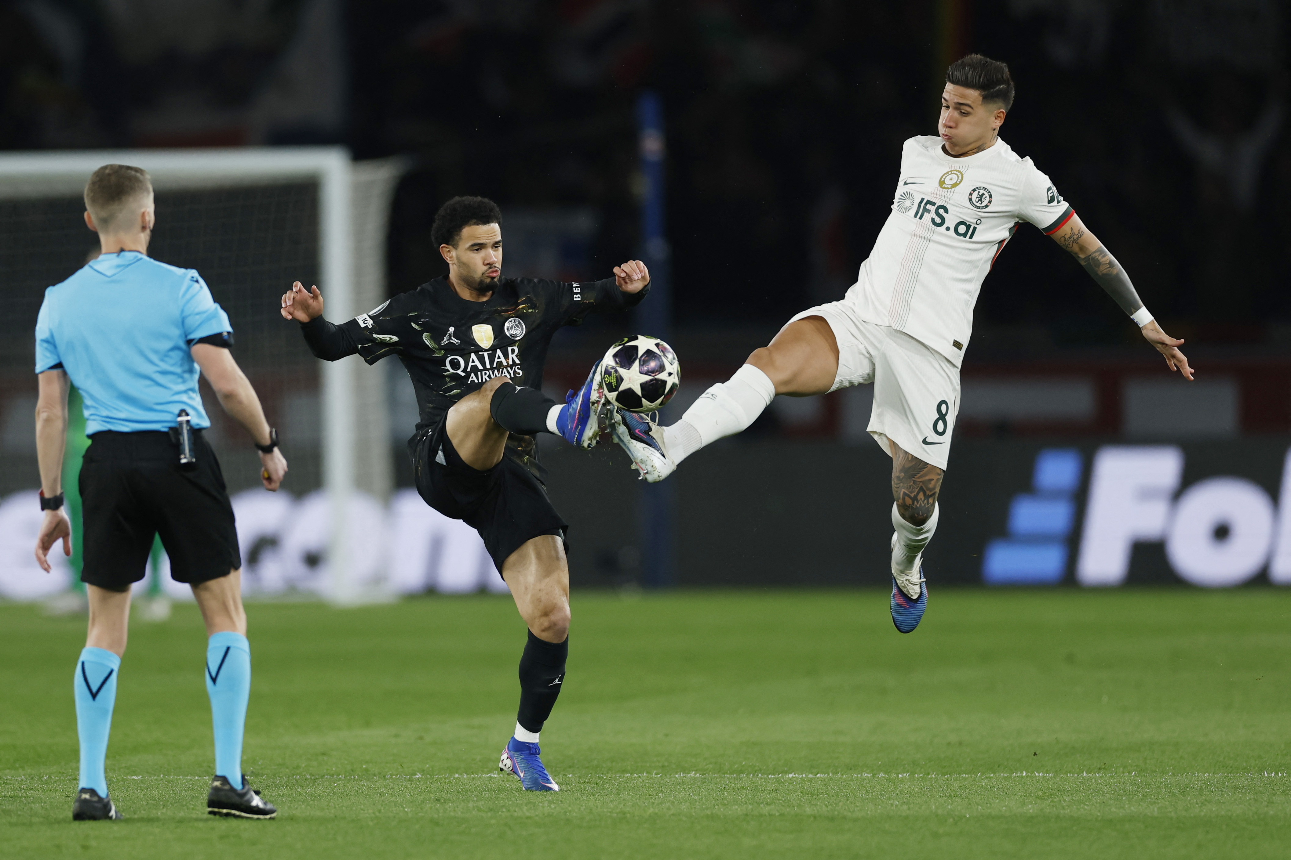 Soccer Football - UEFA Champions League - Round of 16 - First Leg - Paris St Germain v Chelsea - Parc des Princes, Paris, France - March 11, 2026 Chelsea's Enzo Fernandez in action with Paris St Germain's Warren Zaire-Emery Action Images via Reuters/Peter Cziborra
