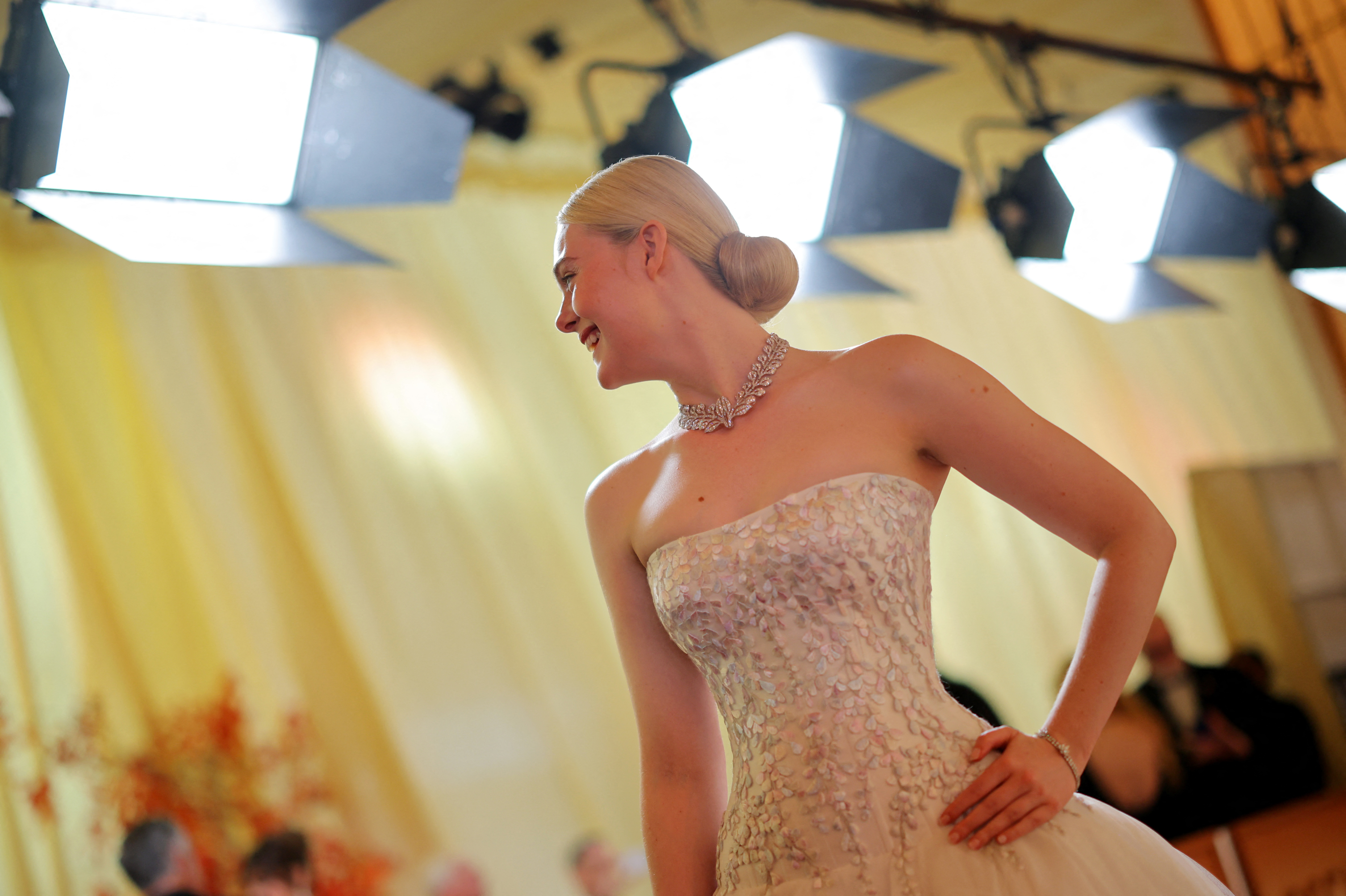 Elle Fanning poses on the red carpet during the Oscars arrivals at the 98th Academy Awards in Hollywood, Los Angeles, California, U.S., March 15, 2026.    REUTERS/Carlos Barria