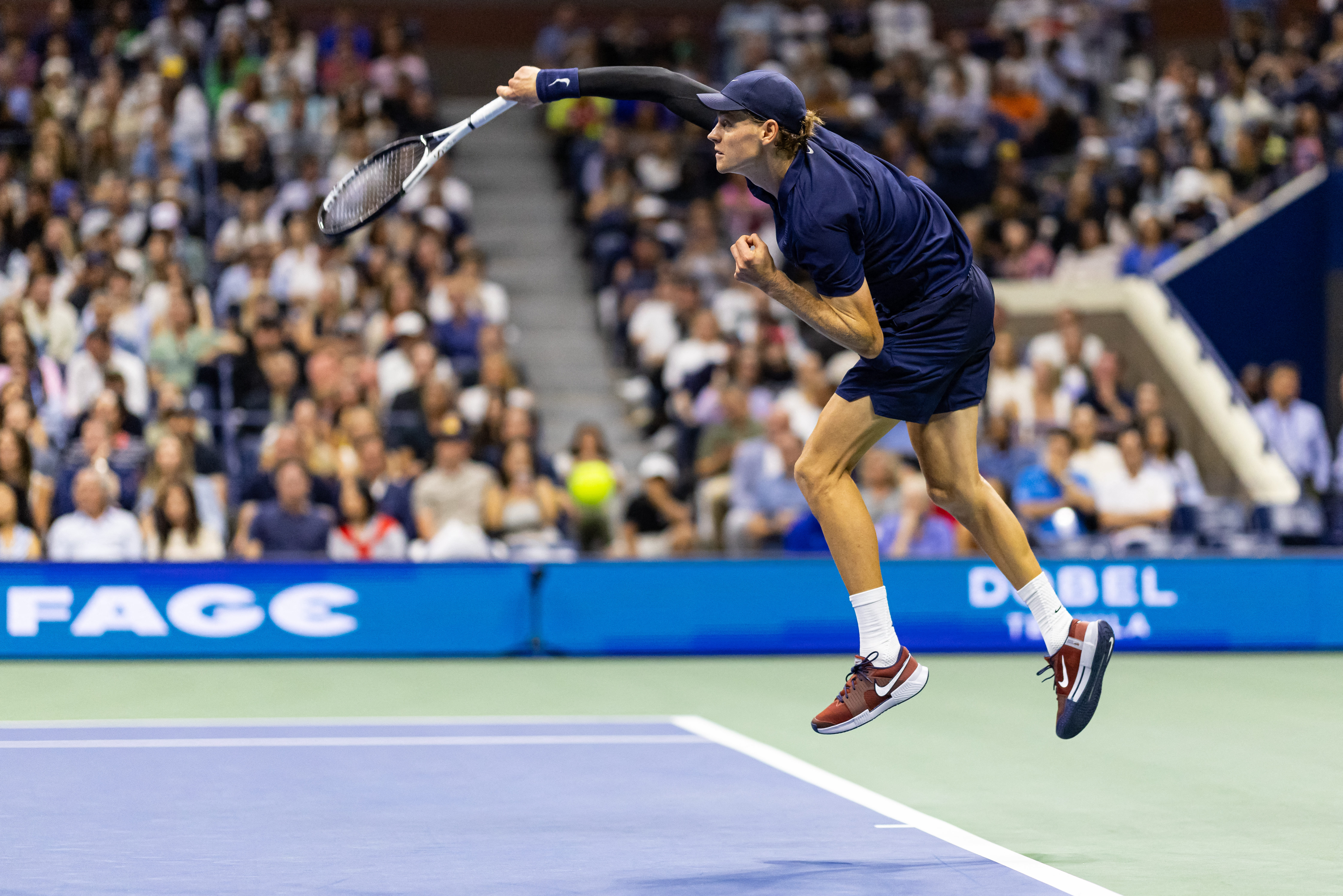 Sep 1, 2025; Flushing, NY, USA; Jannik Sinner of Italy serves against Alexander Bublik of Kazakhstan in the fourth round of the men’s singles at the US Open at Arthur Ashe Stadium in Billie Jean King National Tennis Center. Mandatory Credit: Mike Frey-Imagn Images