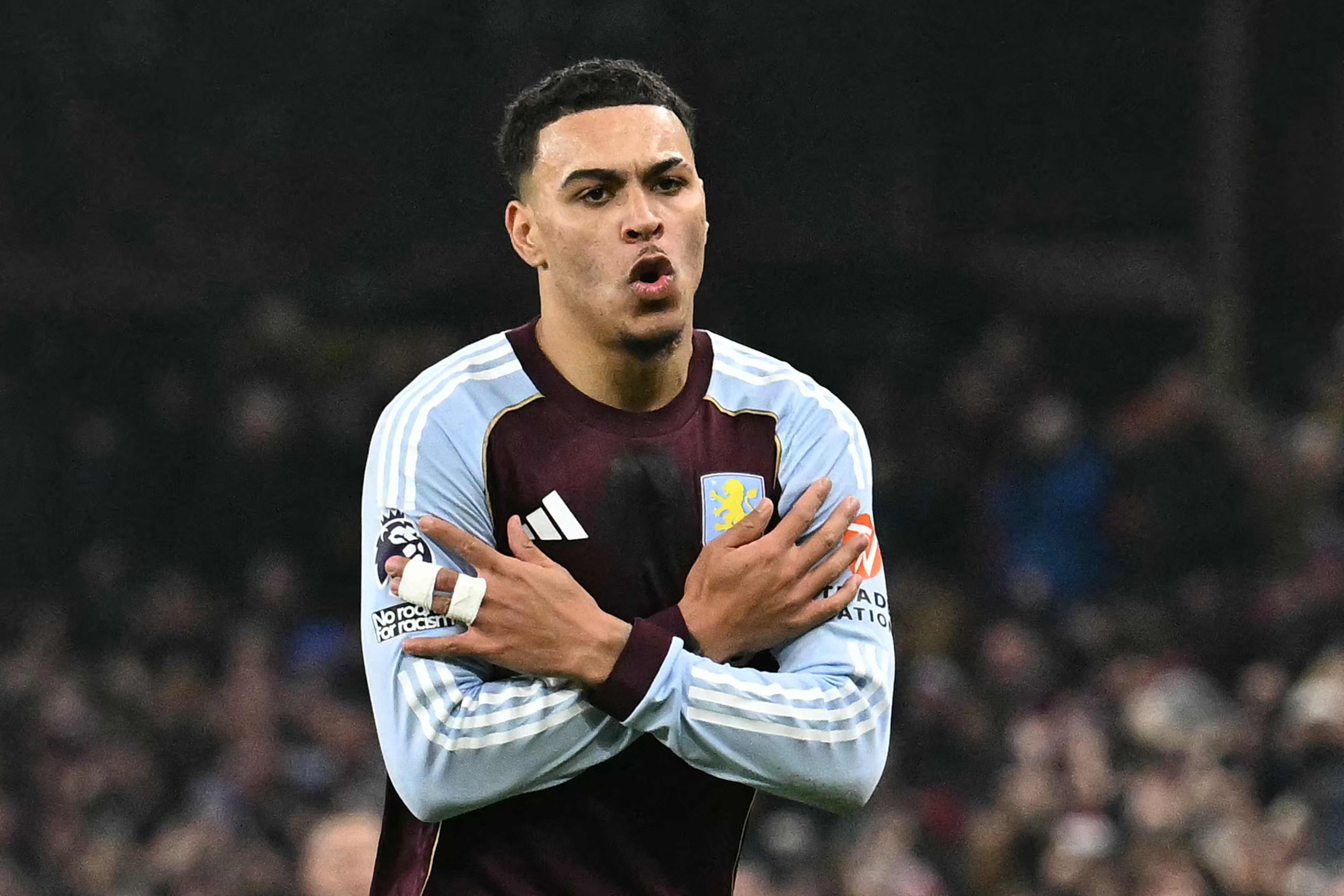 Aston Villa's English midfielder #27 Morgan Rogers celebrates scoring his team's first goal to take the lead 1-0 during the English Premier League football match between Aston Villa and Manchester United at Villa Park in Birmingham, central England on December 21, 2025. (Photo by Ben STANSALL / AFP) / RESTRICTED TO EDITORIAL USE. No use with unauthorized audio, video, data, fixture lists, club/league logos or 'live' services. Online in-match use limited to 120 images. An additional 40 images may be used in extra time. No video emulation. Social media in-match use limited to 120 images. An additional 40 images may be used in extra time. No use in betting publications, games or single club/league/player publications. / 