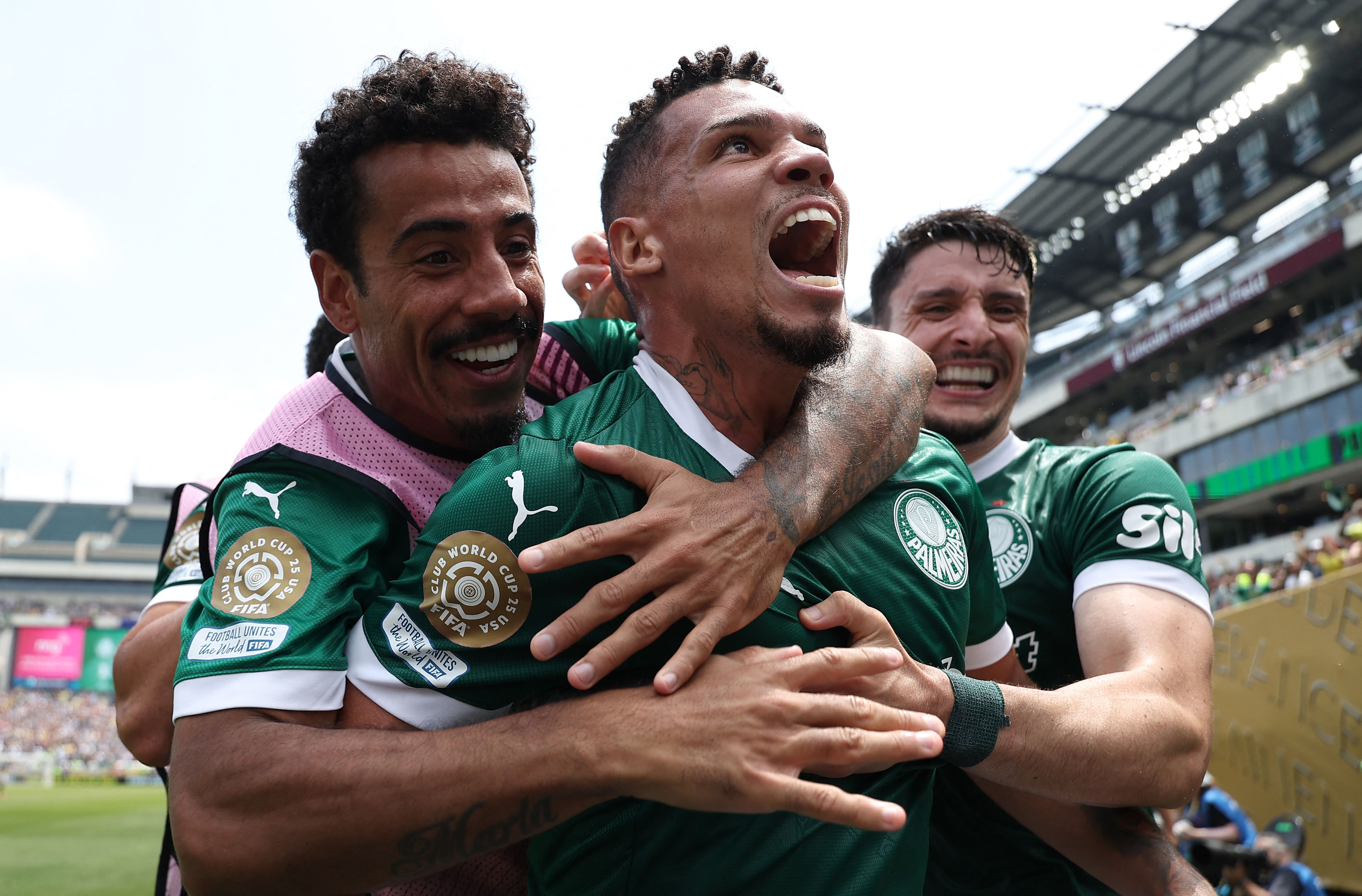 Palmeiras' Brazilian forward #10 Paulinho (C) celebrates with teammates after scoring the opening goal during the FIFA Club World Cup 2025 round of 16 all-Brazilian football match between Palmeiras and Botafogo at Lincoln Financial Field Stadium in Philadelphia on June 28, 2025. (Photo by FRANCK FIFE / AFP)