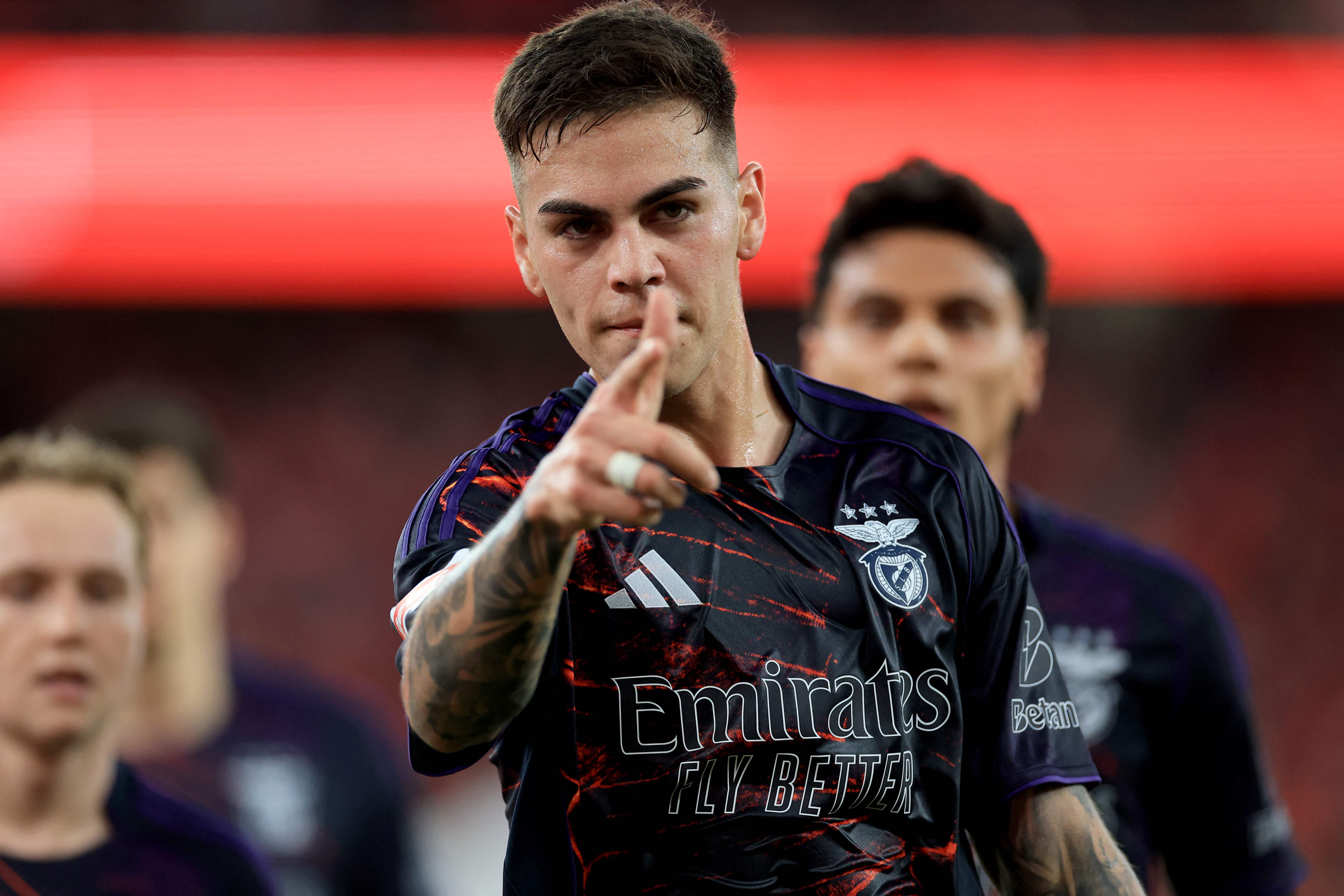 SL Benfica's Argentine midfielder #05 Enzo Barrenechea celebrates scoring his team's second goal during the Portuguese League football match between SL Benfica and AVS Futebol SAD at Estadio da Luz in Lisbon on February 21, 2026. (Photo by PATRICIA DE MELO MOREIRA / AFP)
