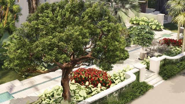 Le jardin autour de la maison est agrémenté de points d'eau avec des fontaines en forme d'étoile et d'un arbre Banyan.
