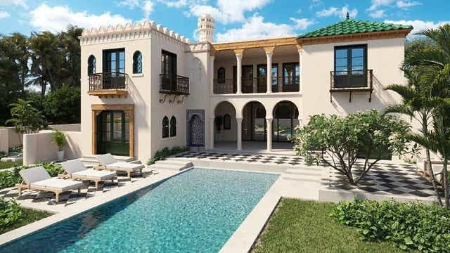 La façade de la maison s'ouvre sur une veranda, une piscine et un magnifique jardin inspiré du Maroc.
