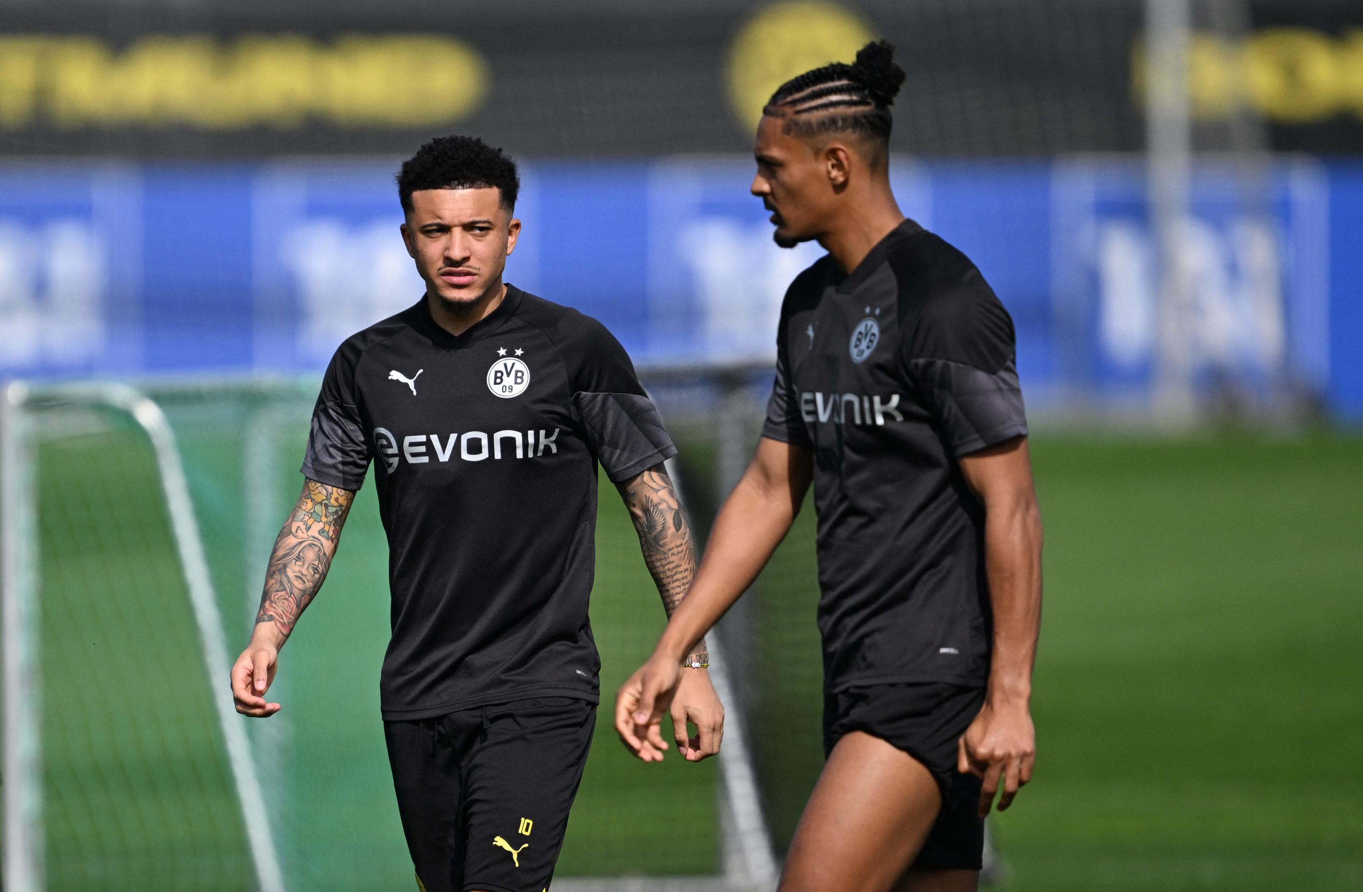 Sebastien Haller en compagnie de Jadon Sancho ce mardi à l'entraînement du Borussia Dortmund. Ina FASSBENDER / AFP