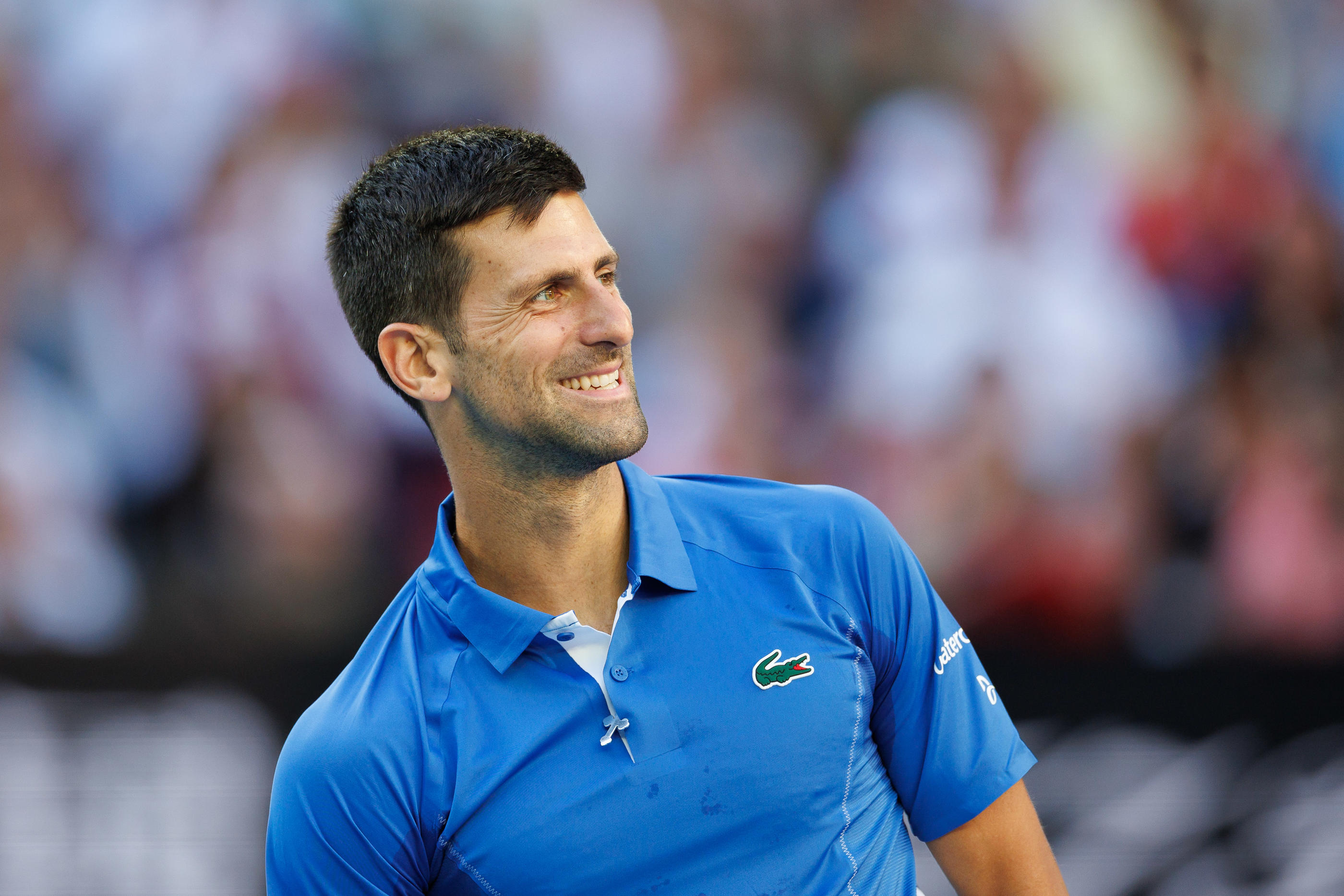 Avant de partir en quête de son onzième Open d'Australie dimanche, Novak Djokovic (ici lors d'un évènement caritatif précédant le tournoi) arbore un sourire qui en dit long. SUSA/Icon Sport