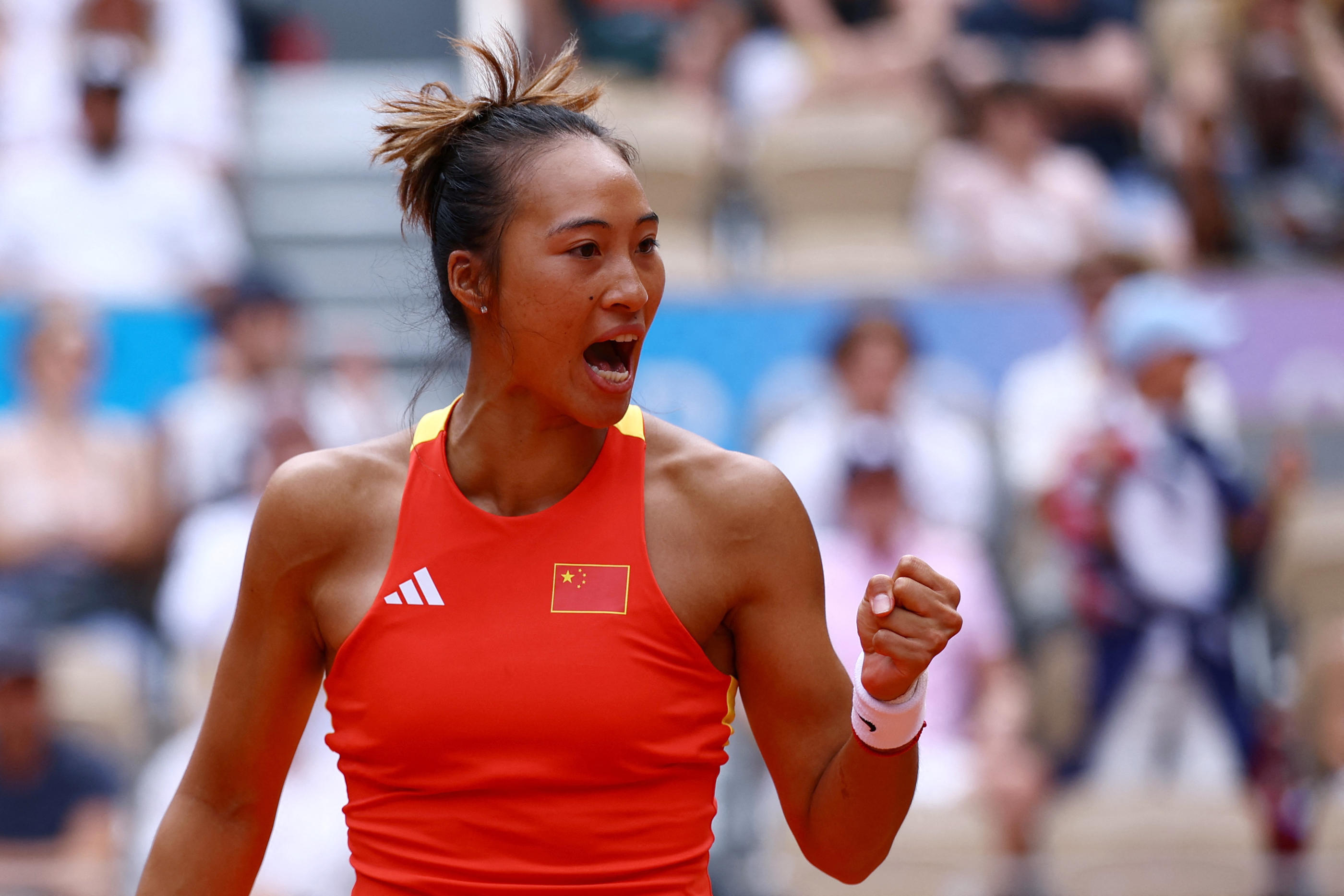 Paris 2024 Olympics - Tennis - Women's Singles Gold Medal Match - Roland-Garros Stadium, Paris, France - August 03, 2024. Qinwen Zheng of China reacts during her match against Donna Vekic of Croatia. REUTERS/Edgar Su