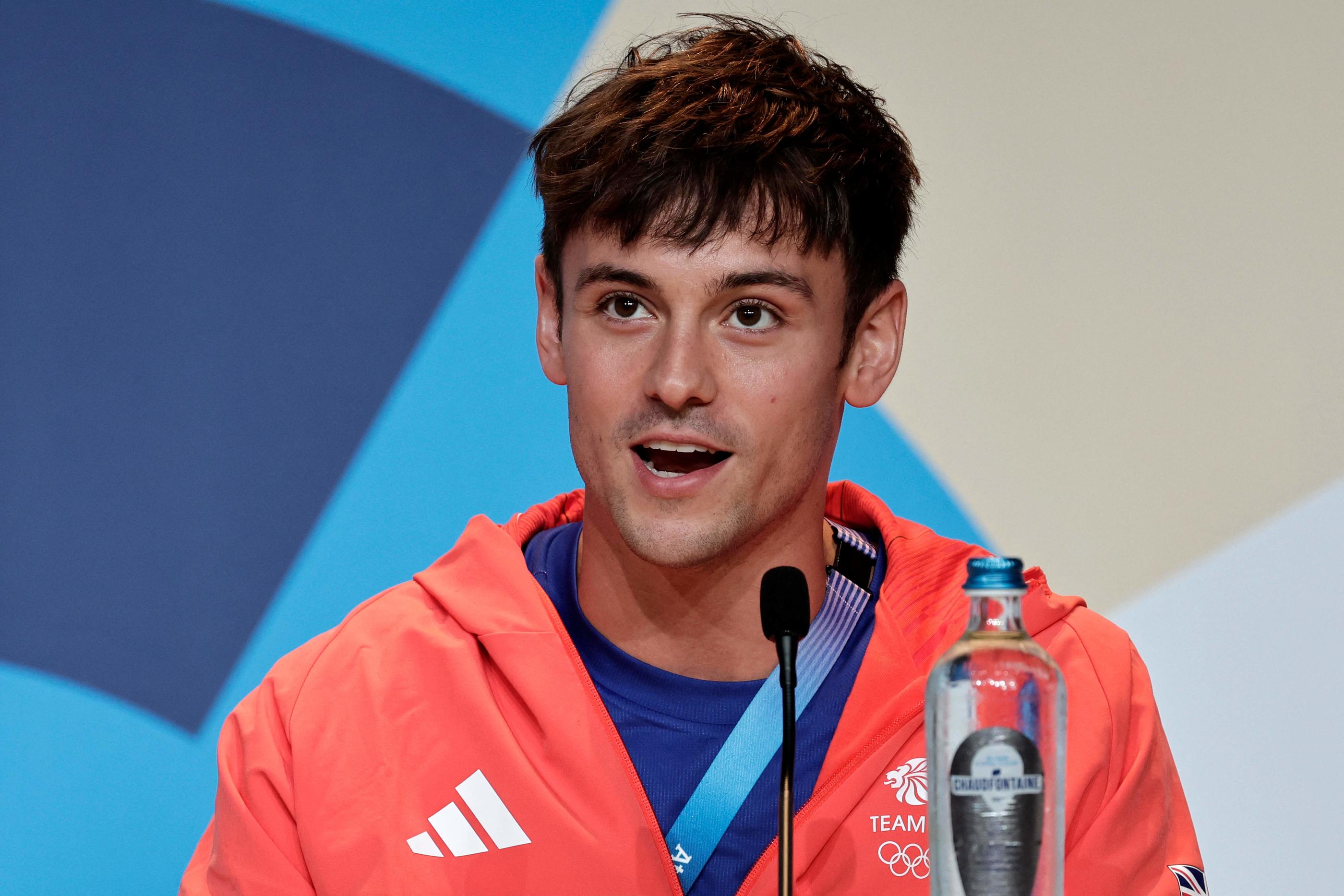 Tom Daley, médaille d'argent sur le plongeon 10 m synchronisé, a réussi à concilier vie de famille et sport de haut niveau.  STEPHANE DE SAKUTIN / AFP