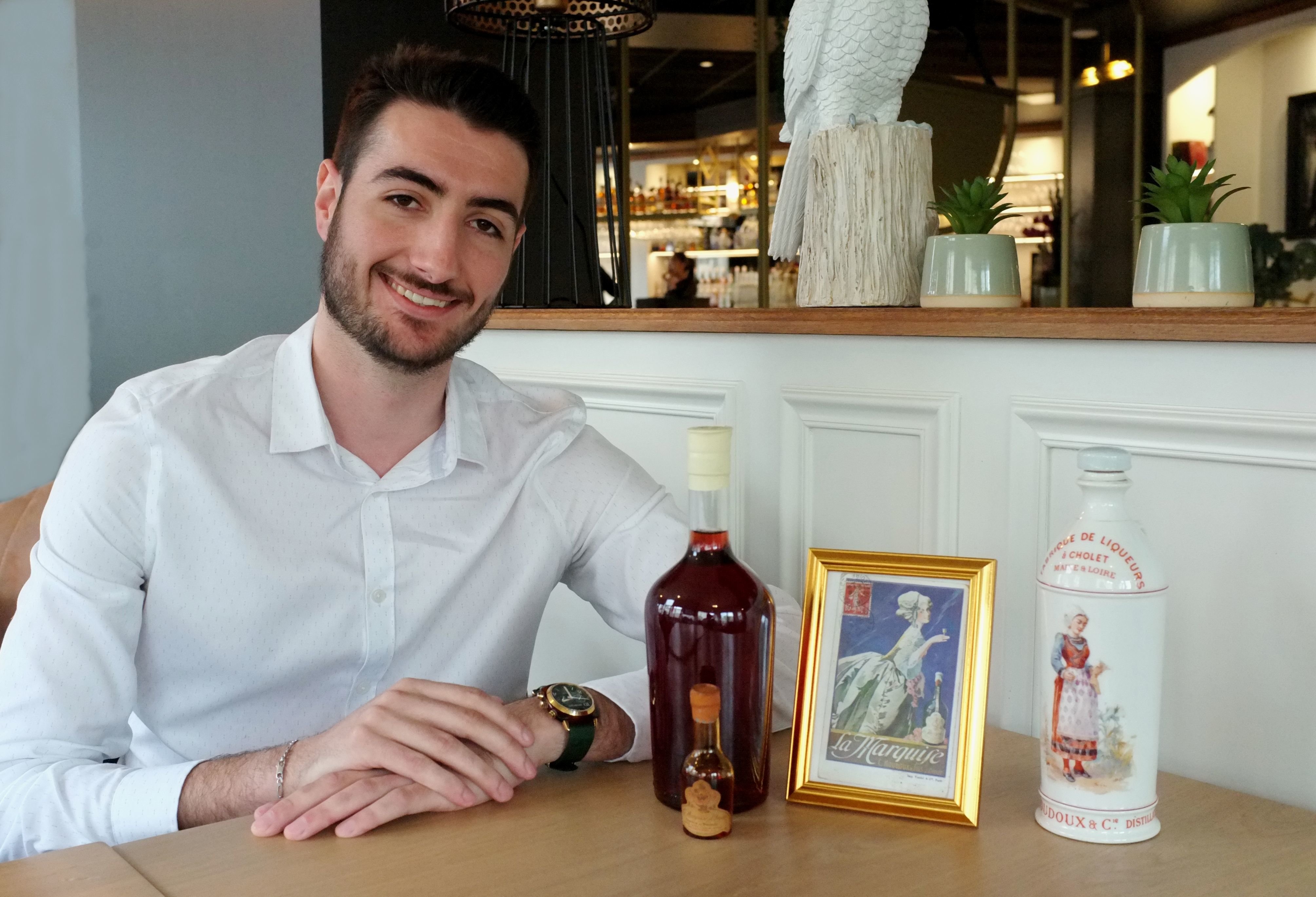 Martin Pelletier, 23 ans, a fouillé les Archives nationales pour retrouver la recette de La Marquise d'Anjou, la mythique liqueur de cerise de Cholet disparue dans les années 1950. Il relance sa production en 2023. LP/Michel Dalloni