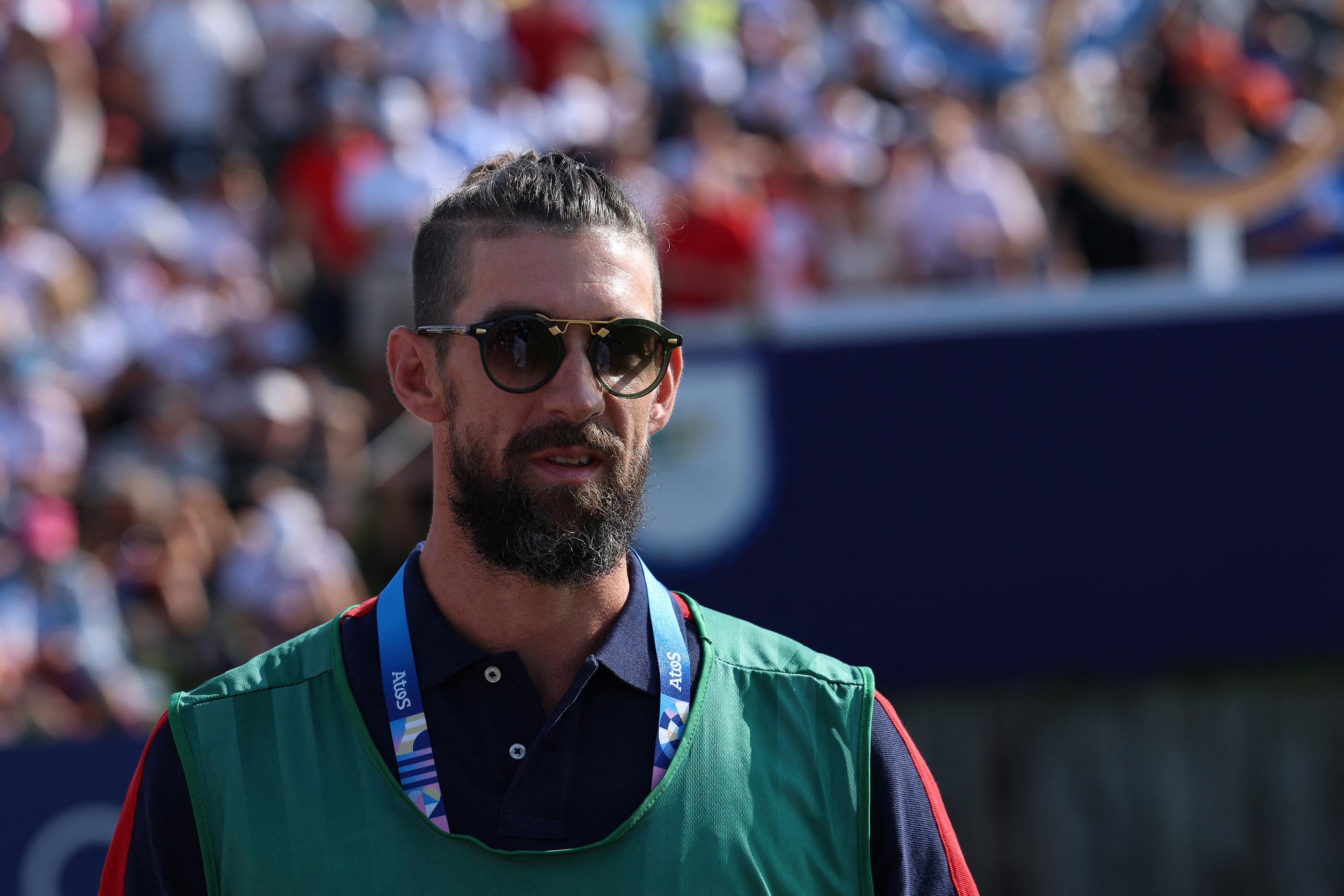 Michael Phelps, ici sur le parcours de golf des JO, s'est dit impressionné par les performances de Léon Marchand. AFP/Emmanuel Dunand