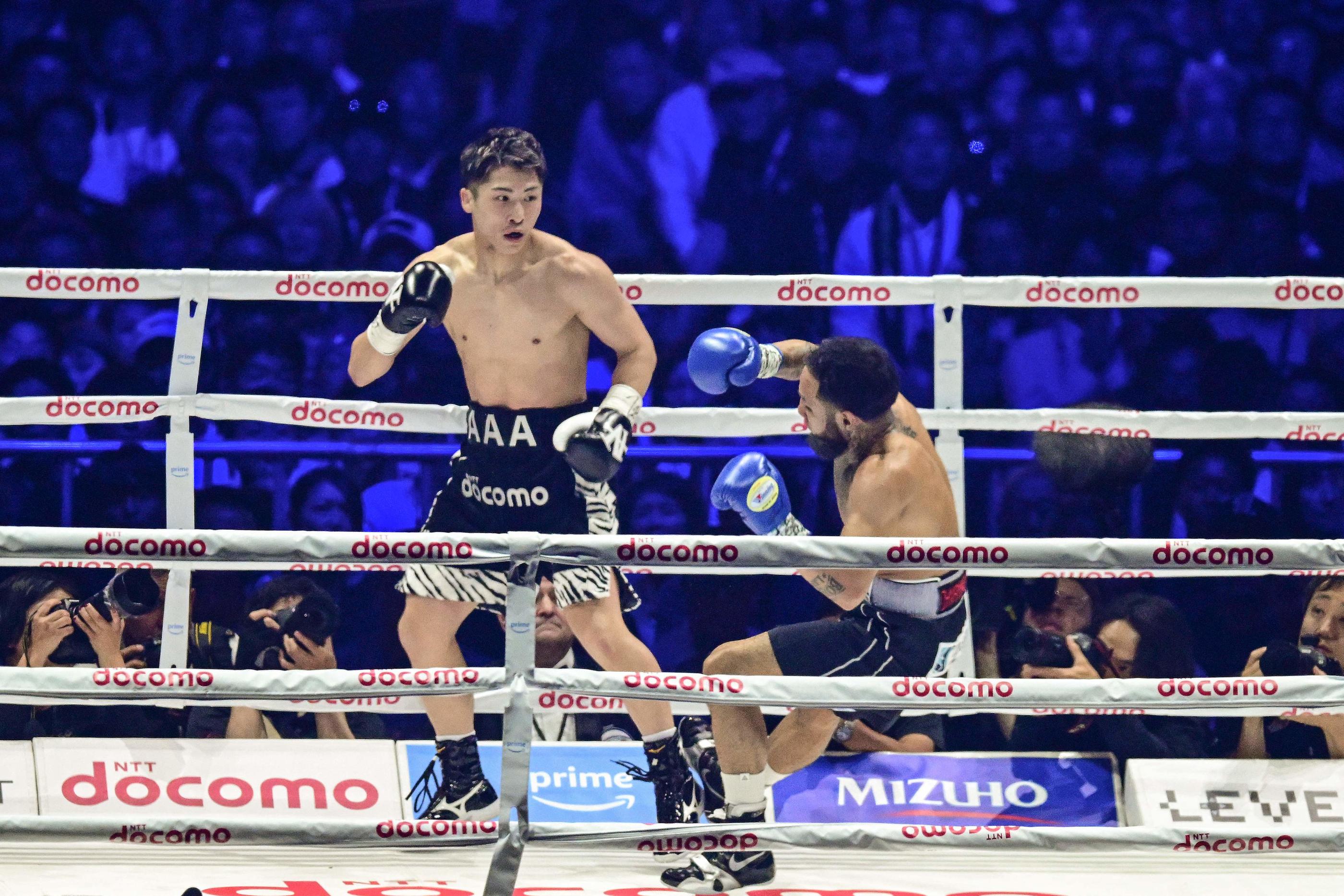 Naoya Inoue a conservé ses titres de champion du monde des super-coqs face au Mexicain Luis Nery. AFP/Philip Fong