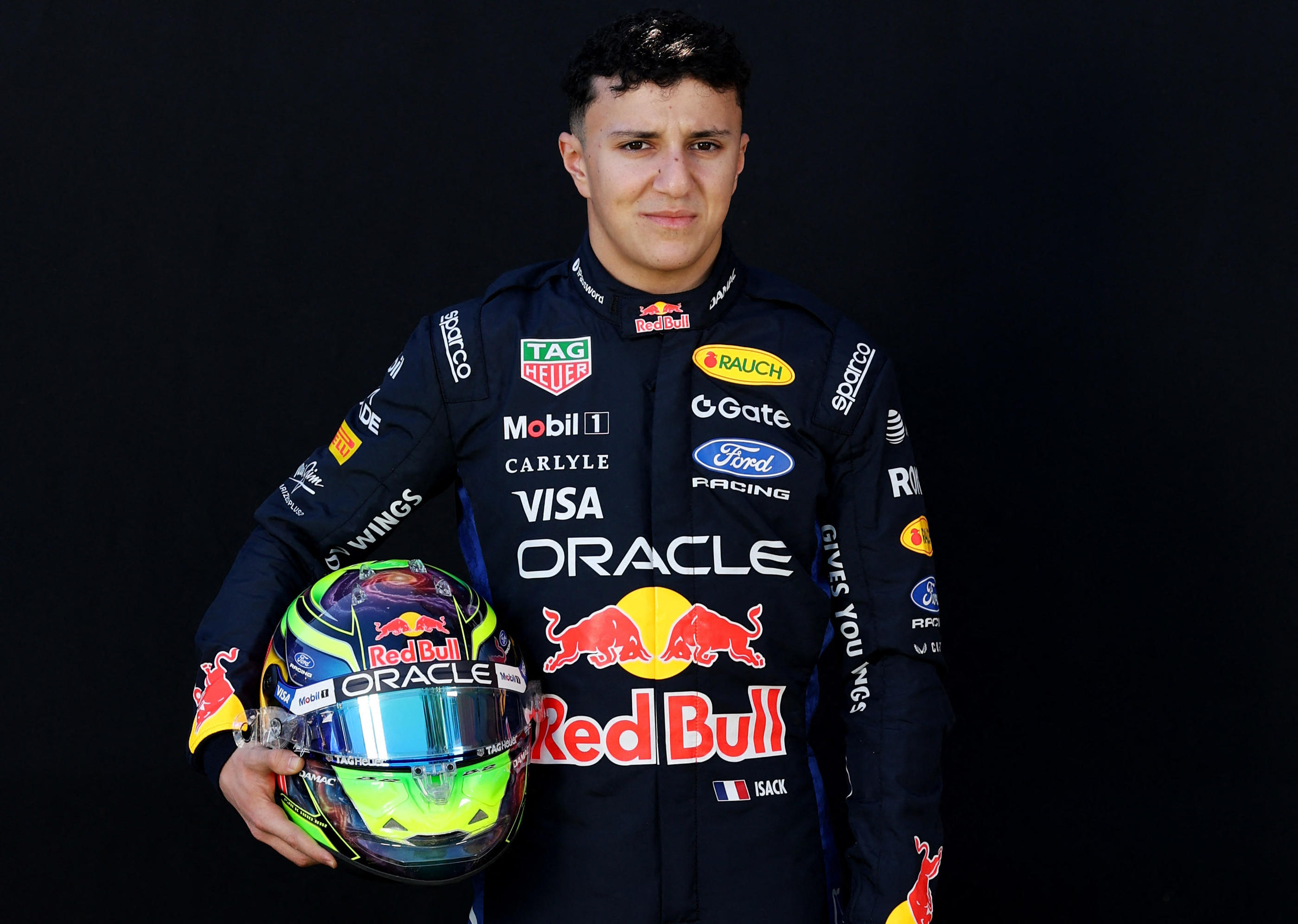 Isack Hadjar wearing Red Bull Racing's regular dark 2026 race suit