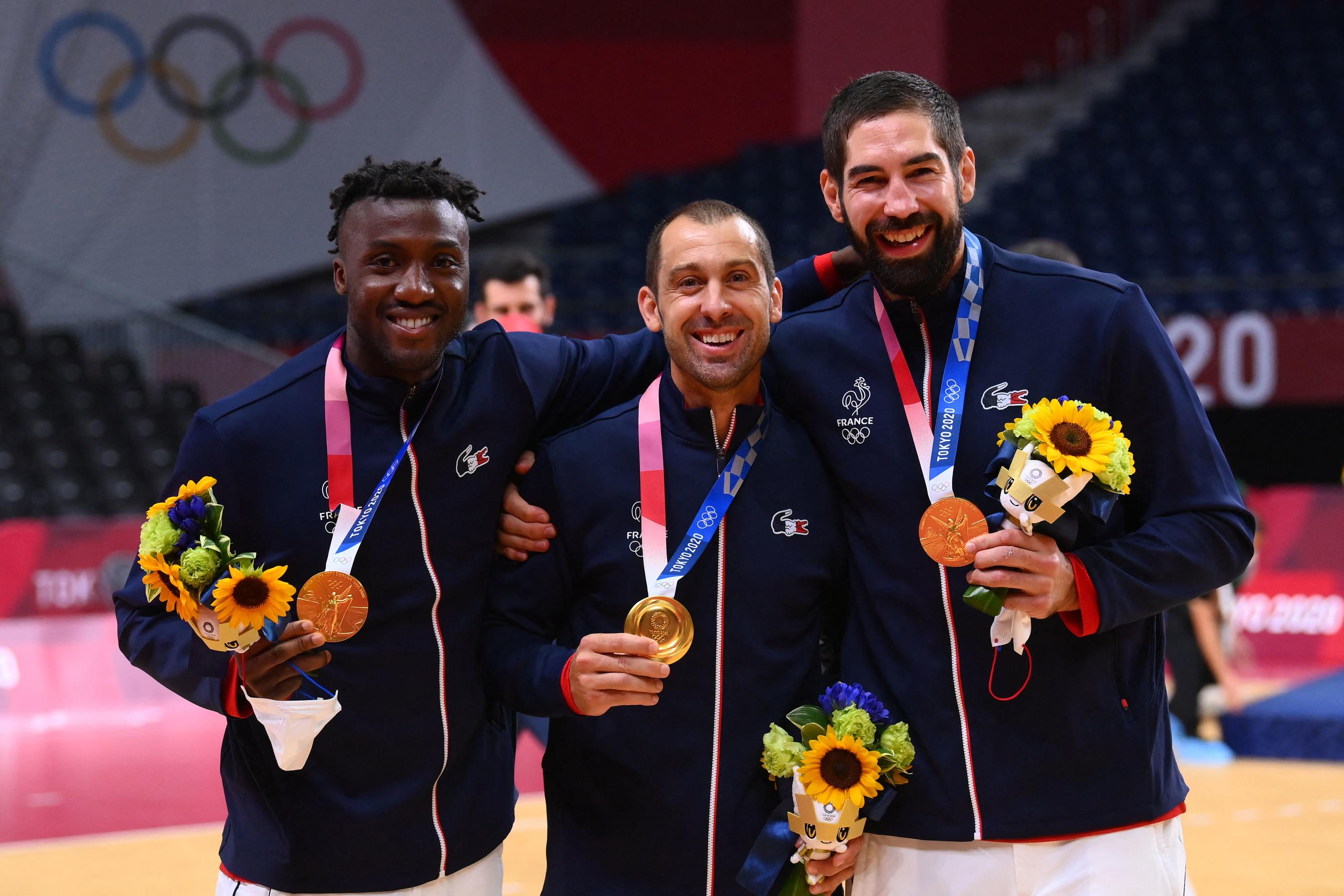 Luc Abalo, Michaël Guigou et Nikola Karabatic ont offert trois titres olympiques à l'équipe de France de handball. AFP/Franck Fife