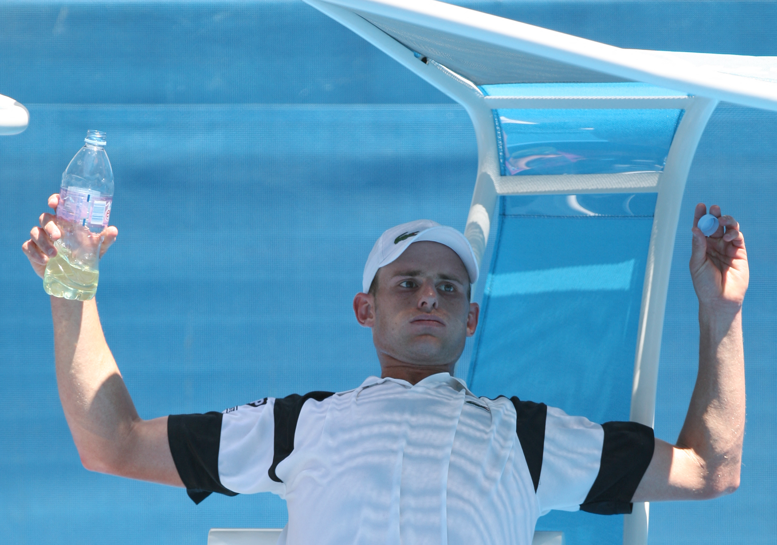 Andy Roddick of the US gestures during a break in his first round mens singles match against Bjorn Rehnquist of Sweden at the Australian Open Tennis tournament in Melbourne on January 19, 2009.   Roddick won 6-0, 6-2. 6-2. . AFP PHOTO/William WEST (Photo by WILLIAM WEST / AFP)