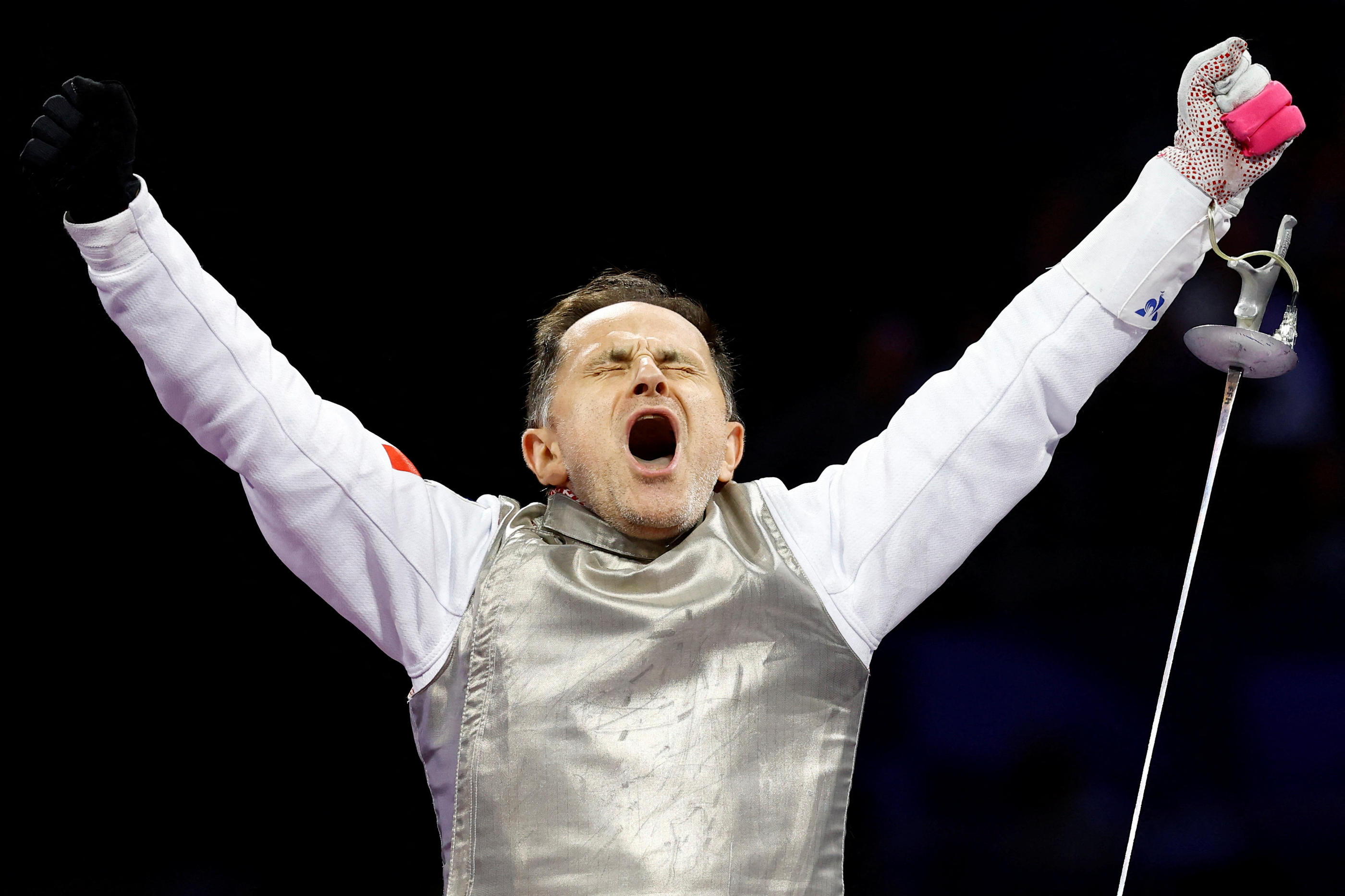 Damien Tokatlian exulte après la victoire des Bleus face à l'Italie, synonyme de bronze... REUTERS/Carlos Garcia Rawlins