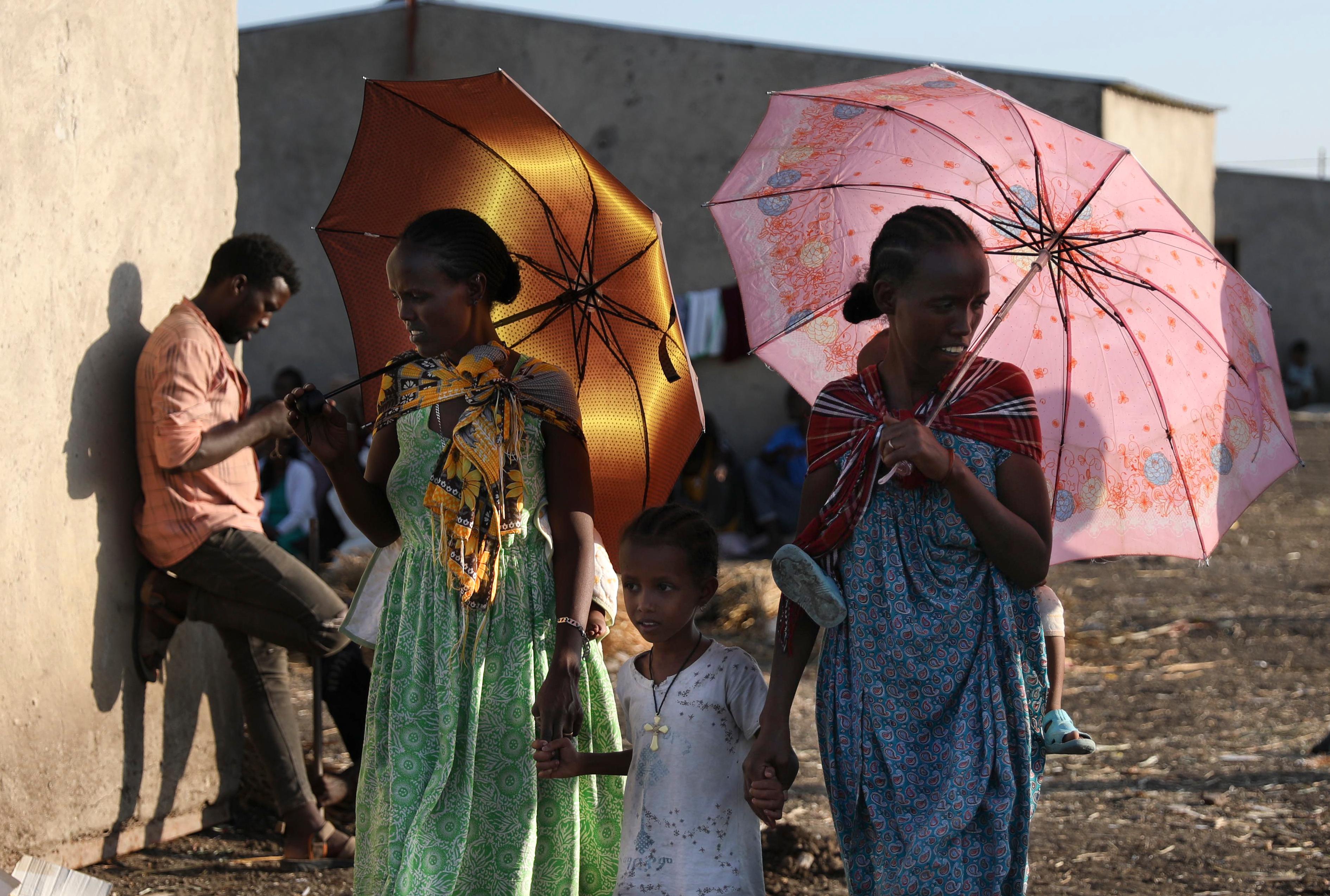 Ethiopian refugees gather in Qadarif region, easter Sudan, Monday, Nov. 16, 2020. The U.N. refugee agency says Ethiopia's growing conflict has resulted in thousands fleeing from the Tigray region into Sudan as fighting spilled beyond Ethiopia's borders and threatened to inflame the Horn of Africa region. (AP Photo/Marwan Ali)