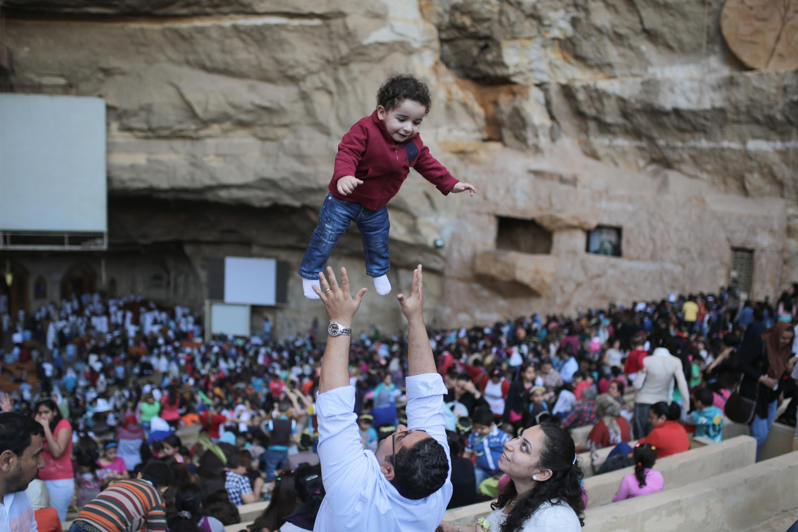 Egyptian Orthodox Christians celebrate Palm Sunday during a service in the Samaan el-Kharaz Church in the Mokattam district of Cairo, Egypt, Sunday, April 5, 2015. For Christians worldwide, Palm Sunday marks Jesus Christ's entrance into Jerusalem, when his followers laid palm branches in his path, prior to his crucifixion. Western Christian churches and most Orthodox Christian churches follow different calendars and observe Easter on different dates. (AP Photo/Mosa'ab Elshamy)