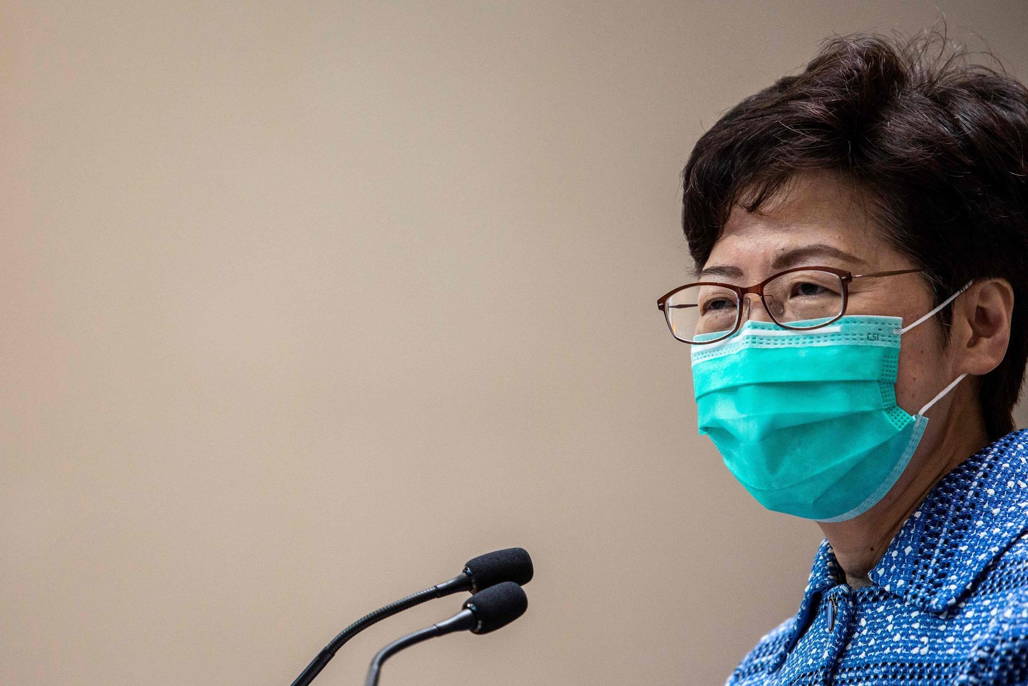 Hong Kong's Chief Executive Carrie Lam takes part in a press conference while wearing a face mask in Hong Kong on March 3, 2020. (Photo by ISAAC LAWRENCE / AFP)