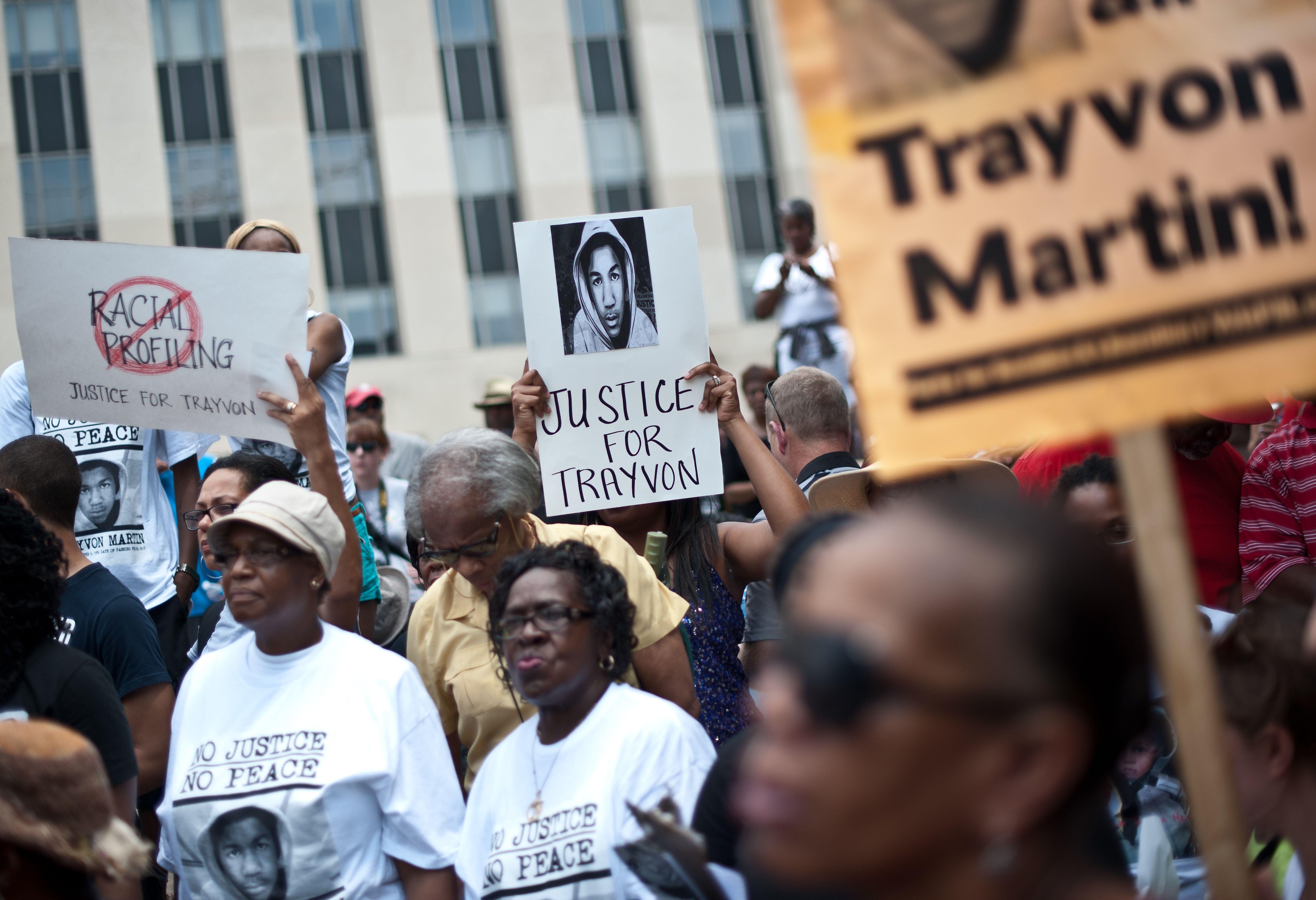 People demonstrate in Washington on July 20, 2013, one week after the acquittal of George Zimmerman. Civil rights groups mobilized for protests in cities across the United States on Saturday amid charged emotions over the not-guilty verdict in the shooting death of unarmed black teenager Trayvon Martin. The demonstrations, which began in Miami, come a day after US President Barack Obama publicly identified with the slain 17-year-old and the deep frustrations felt among African-Americans over the verdict.   AFP PHOTO/Nicholas KAMM