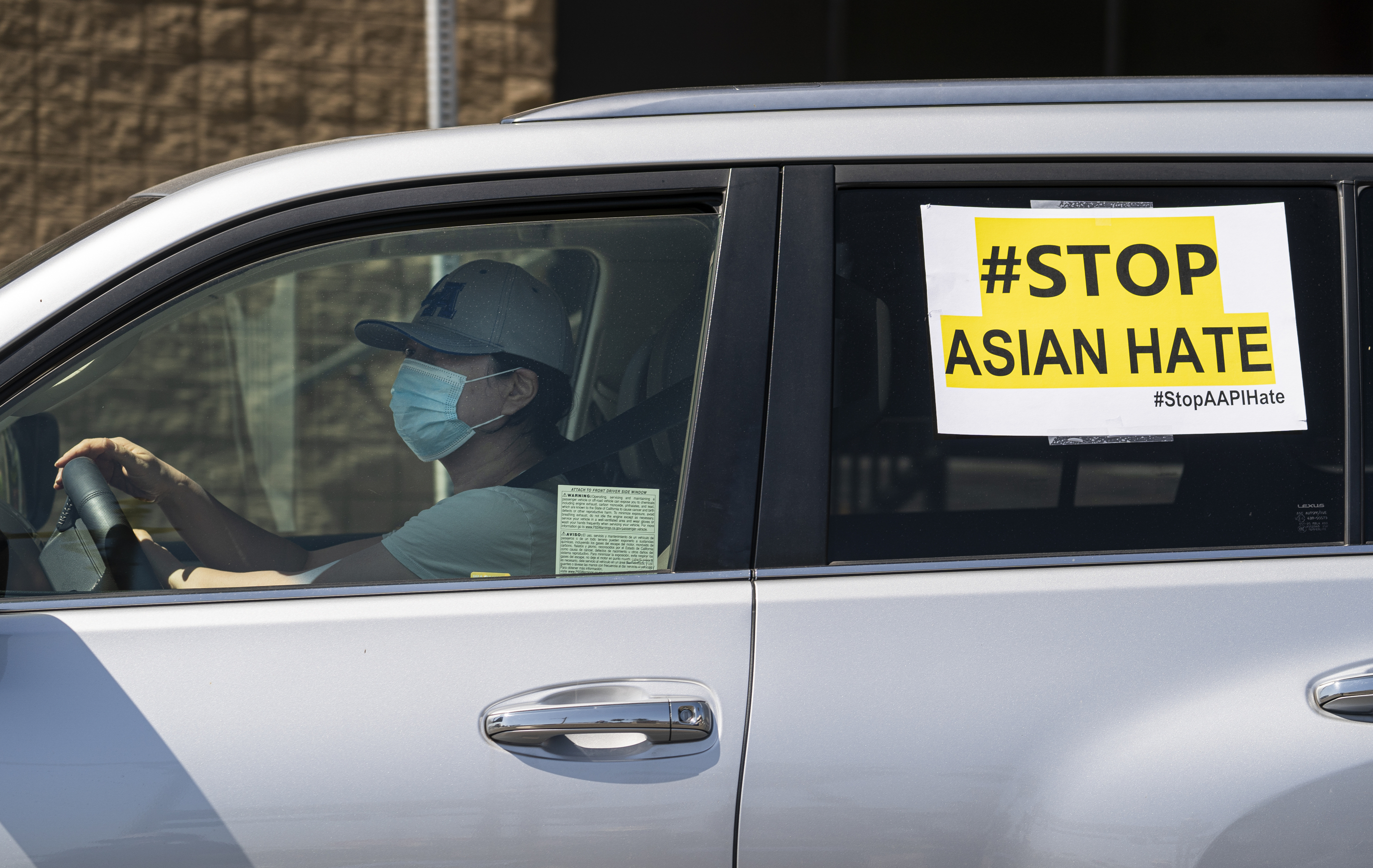 FILE - In this March 19, 2021, file photo, members of the Korean American Federation of Los Angeles drive with signs reading: "#Stop Asian Hate," in a caravan around Koreatown to denounce hate against the Asian American and Pacific Islander communities in Los Angeles. After more than a year filled with attacks on Asian Americans unfairly blamed for the coronavirus, a majority of Americans across racial and ethnic groups believe anti-Asian American discrimination has worsened over the last year. A poll from the The Associated Press-NORC Center for Public Affairs Research finds nearly half of Americans believe Asian Americans encounter "a great deal" or "quite a lot" of discrimination. (AP Photo/Damian Dovarganes, File)