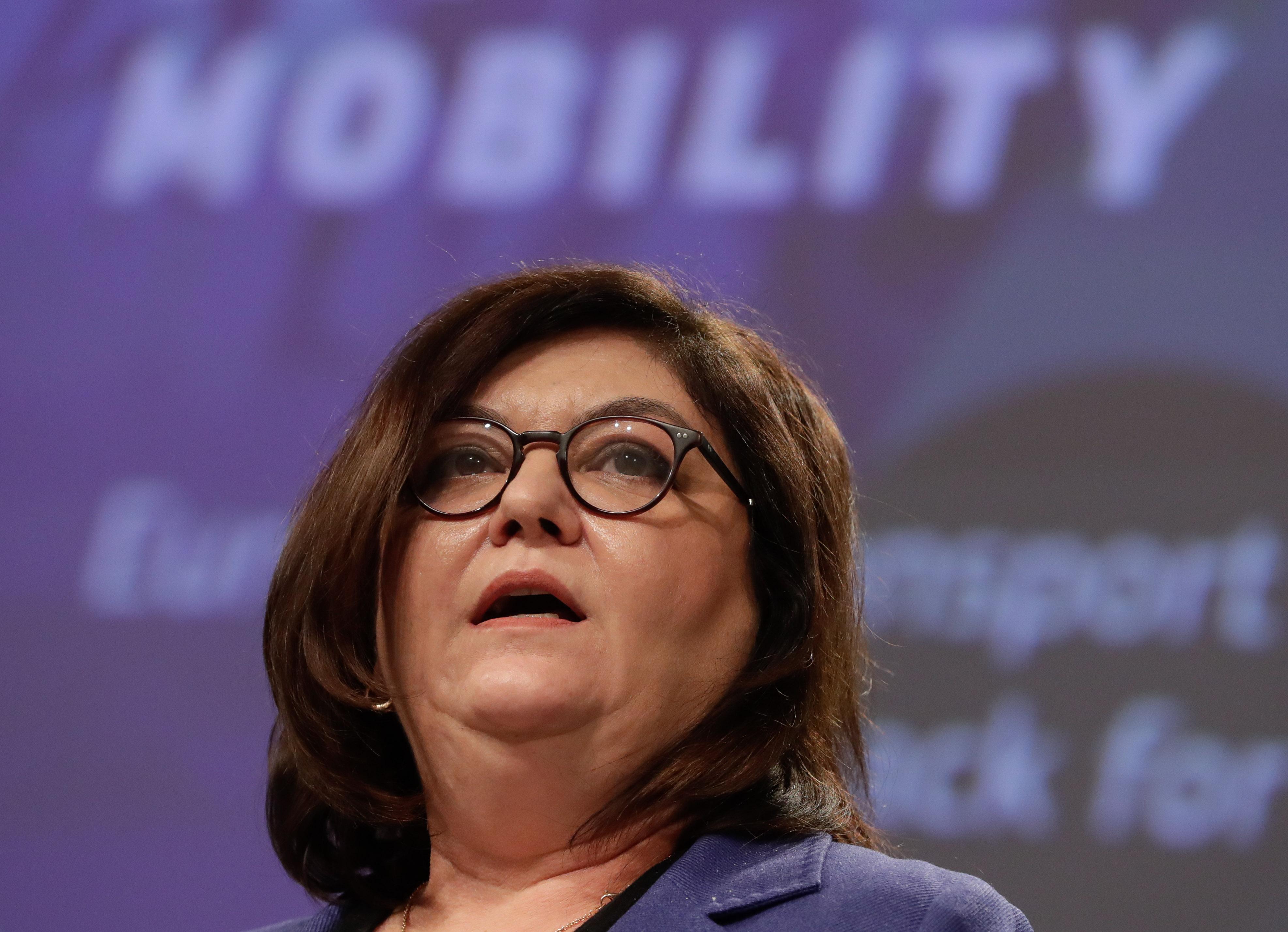 European Commission's Executive Vice-President (unseen) and Commissioner Adina Valean give a press conference on the European Climate Pact and Sustainable transport strategy at the EU headquarters in Brussels on December 9, 2020. (Photo by Stephanie Lecocq / various sources / AFP)