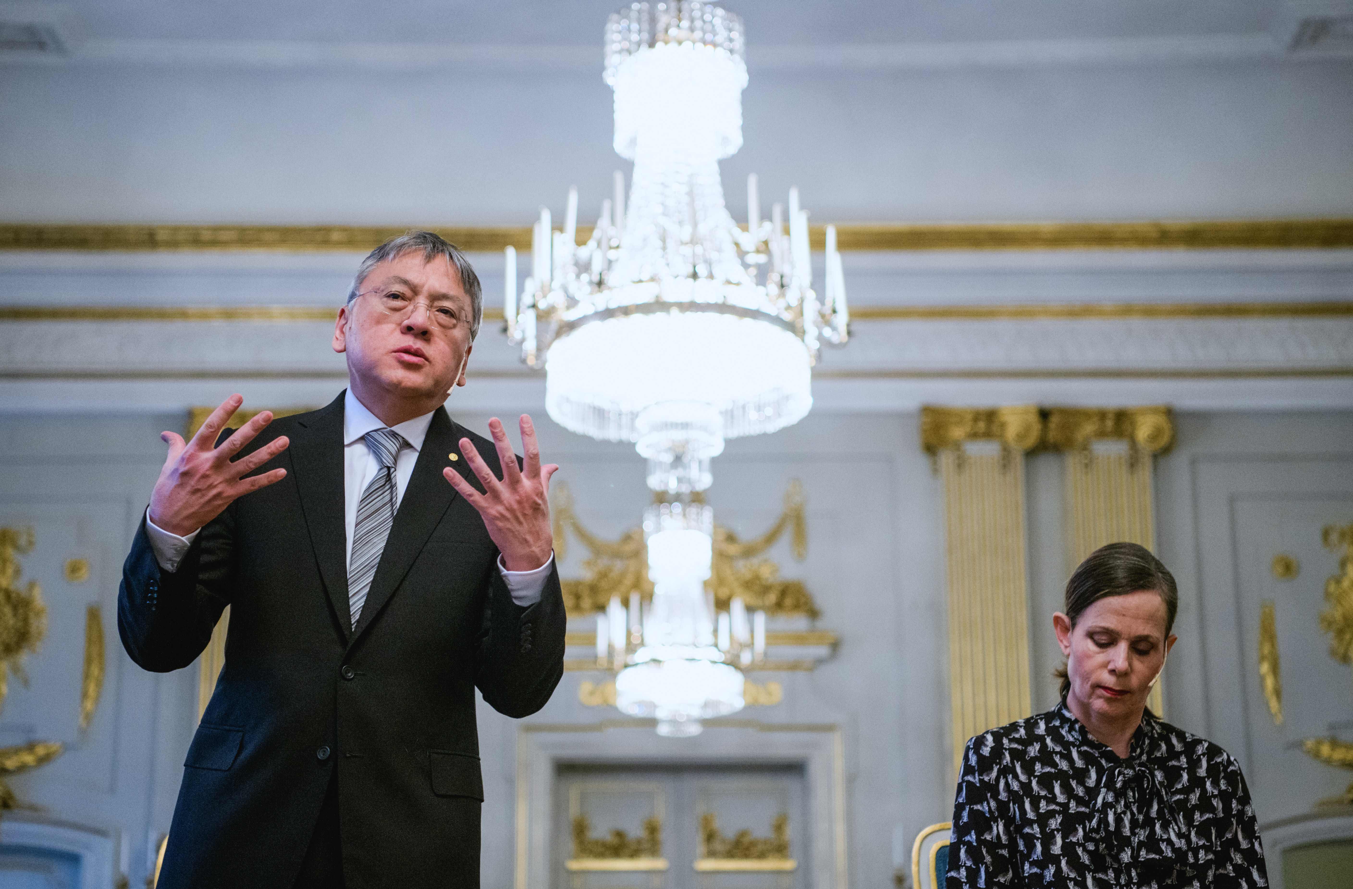 Sara Danius, Permanent Secretary of the Swedish Academy,�reacts as the 2017 Nobel Literature Prize laureate, British writer Kazuo Ishiguro, speaks during a press conference on December 6, 2017 in Stockholm.
Kazuo Ishiguro will receive the prize during an official Nobel Prize ceremony on December 10.  / AFP PHOTO / Jonathan NACKSTRAND