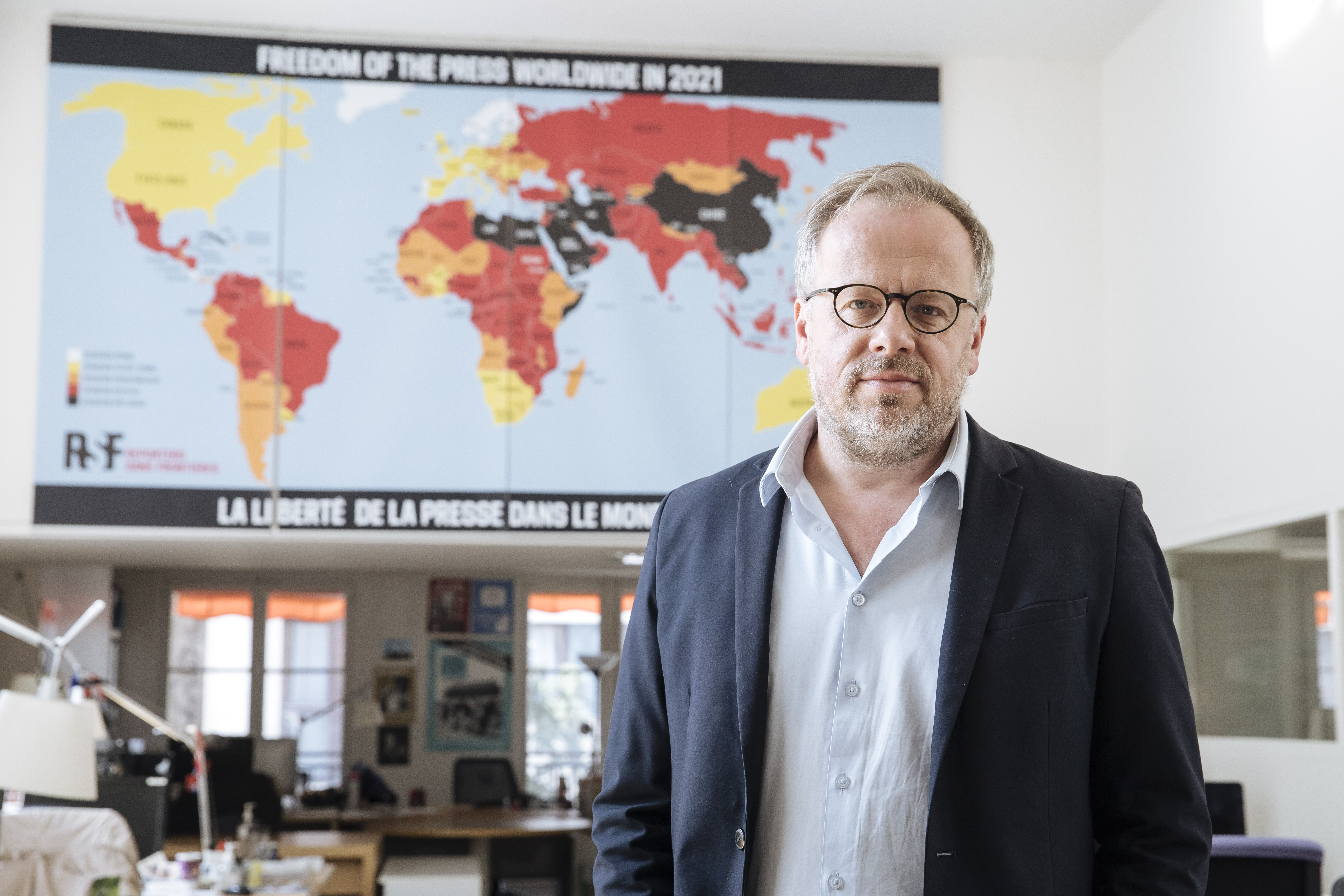 Christophe Deloire, head of RSF (Reporters without borders) stands in front of the 2021 map of press freedom in Paris, France, Tuesday April, 20, 2021. Reporters Without Borders says there has been a "dramatic deterioration" of press freedom since the pandemic tore across the world. Its new World Press Freedom Index evaluated the media in 180 countries and painted a stark picture. The group says in its annual report that 73% of nations have serious issues with media freedom. It says countries have used the pandemic "as grounds to block journalists' access to information, sources and reporting in the field." The media watchdog says it is particularly true for governments in Asia, the Mideast and Europe. (AP Photo/Lewis Joly)